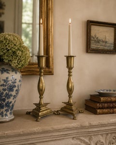 Pair of Mid-Century Neoclassical Brass Paw Foot Candlesticks