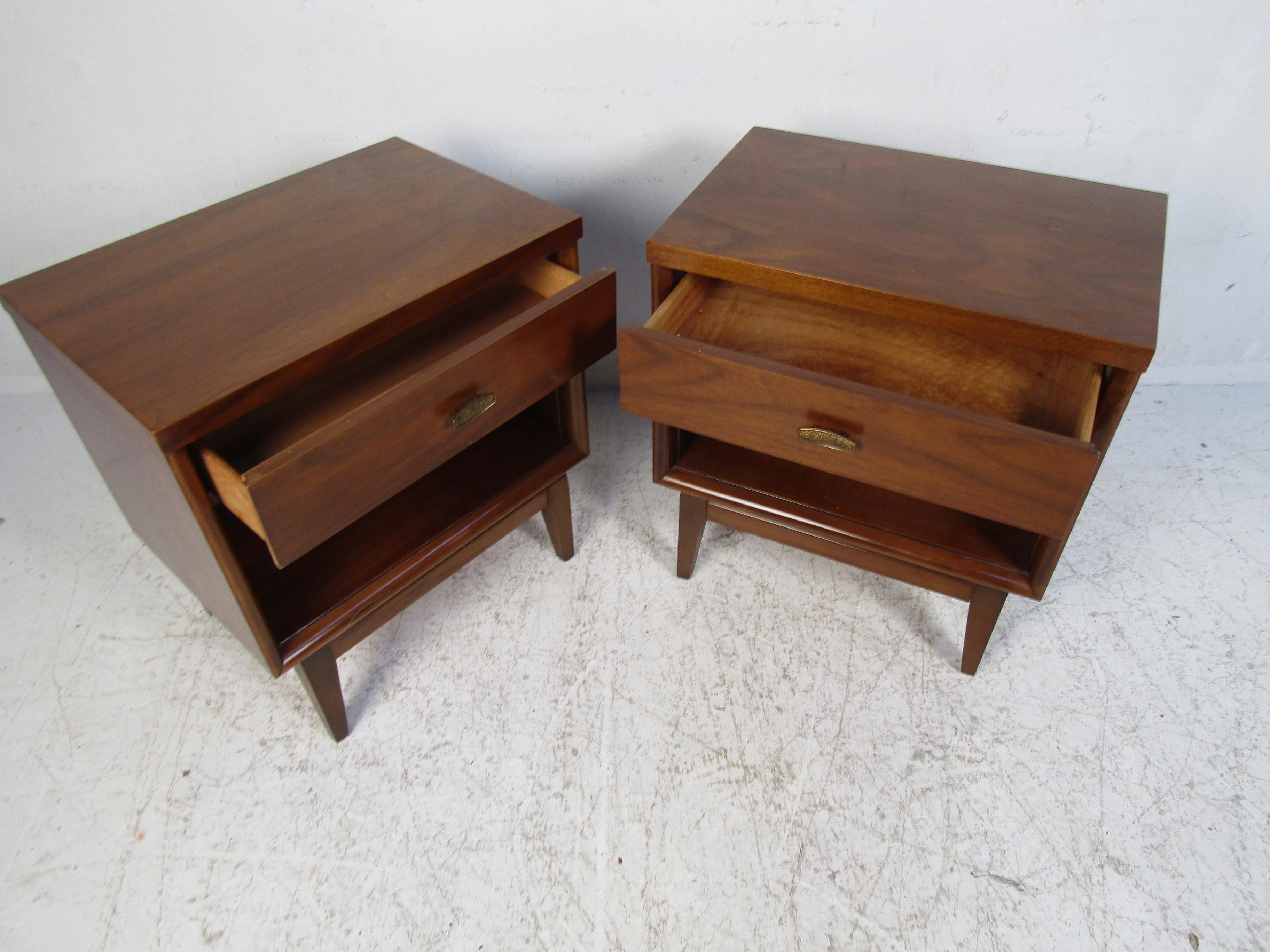 Handsome pair of Mid-Century Modern nightstands. Walnut veneer. Please confirm item location with dealer (NJ or NY).