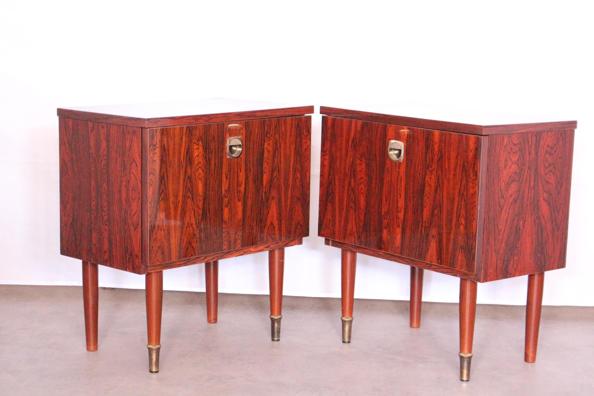 Pair of French side cabinet midcentury, circa 1970
Nightstands 
Stratified high shine wood with faux kingwood effect finish
Brass feet
Drop fronts
Good vintage condition with only very minor marks of use for their age.