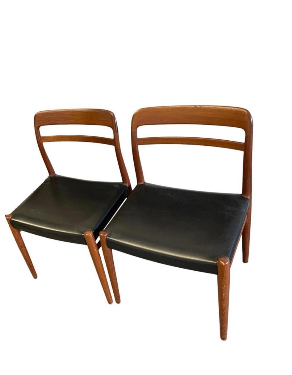 Pair of Mid Century Norwegian teak dining chairs curved back. Black Vinyl seat cushions - Chairs appear to be in original vintage condition. Very clean and sturdy. Stamp under seat. Located in Brooklyn NYC.

This listing is for 2 chairs.

Made in
