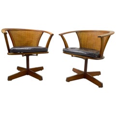 Vintage Pair of Mid Century Oak and Cane Swivel Chairs