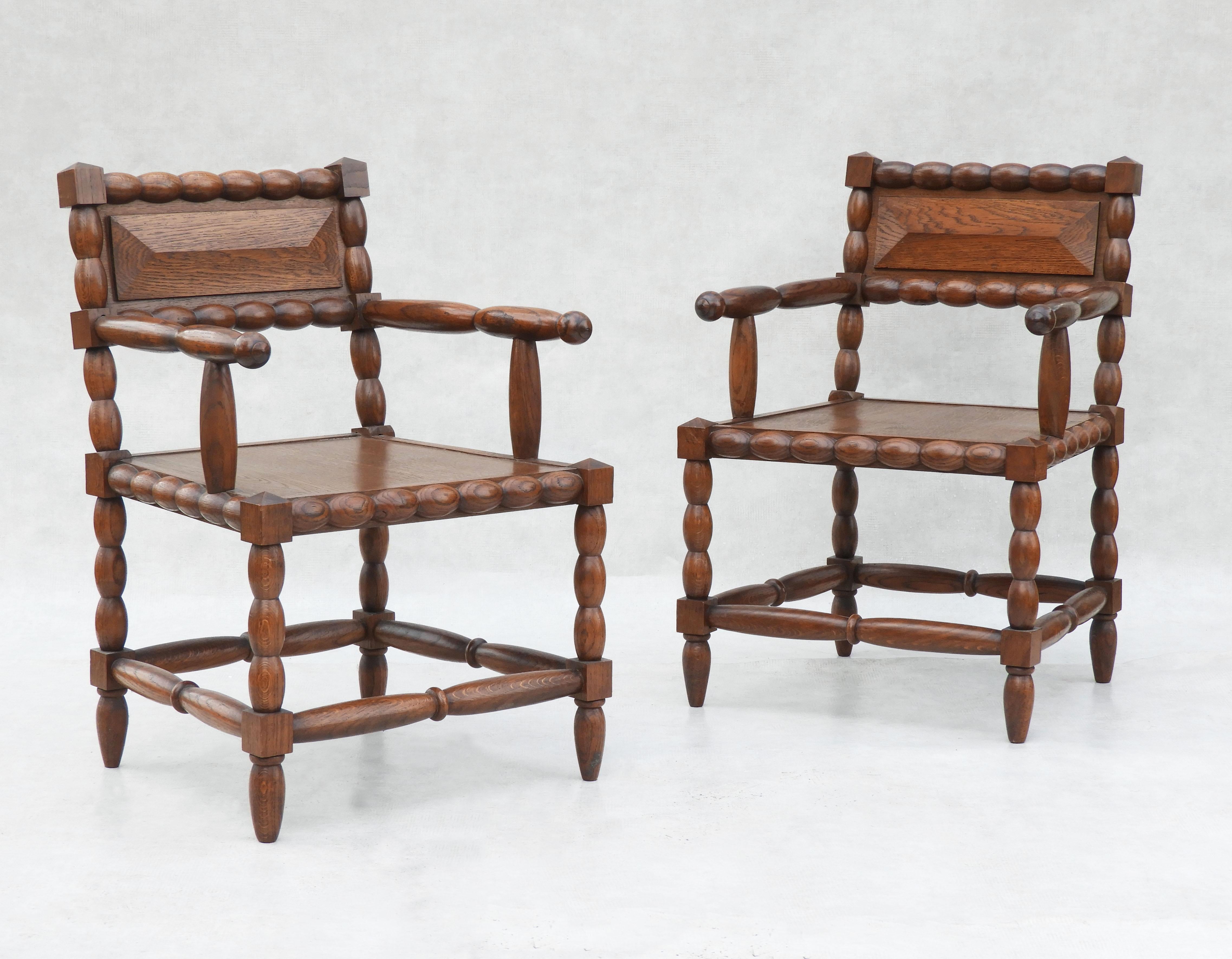 A great pair of oak bobbin wood armchairs from mid-century France C1950. An unusual duo of beautifully turned and carved, medium oak chairs in the style of Charles Dudouyt//Atelier Gentilhommière.  These chairs have a timeless quality that lets them