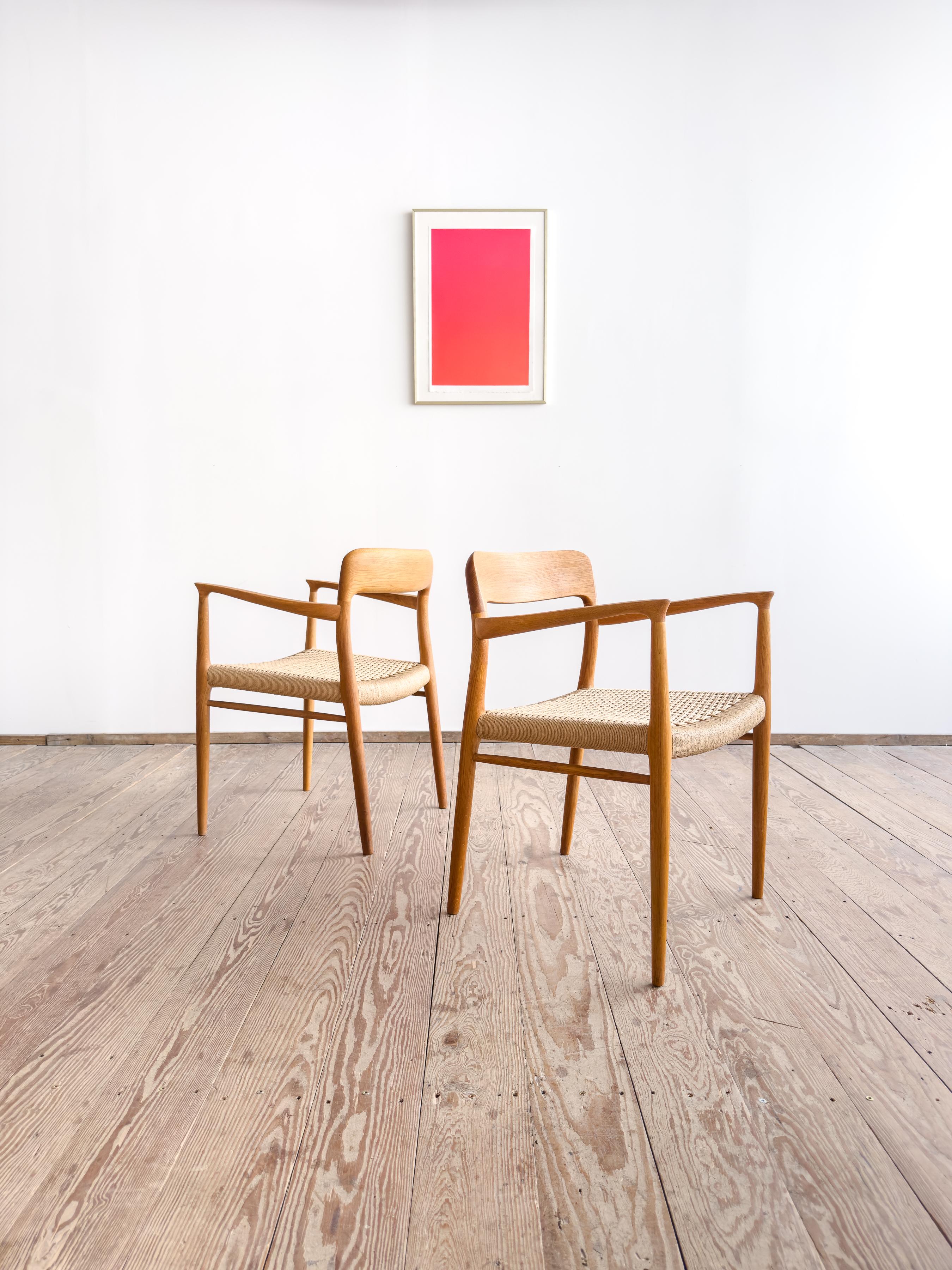 Dimensions: approx. 22.8 × 22.0 × 29.9 × 17.3 in 
(Width × Depth × Height × Seat Height) 

Original set of two dining chairs designed by Niels O. Møller and produced by J.L. Møllers Møbelfabrik, Denmark. The Model 56 is among Møller’s earliest and