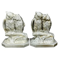 Coppia di reggilibri gufo di metà secolo, sculture in argento