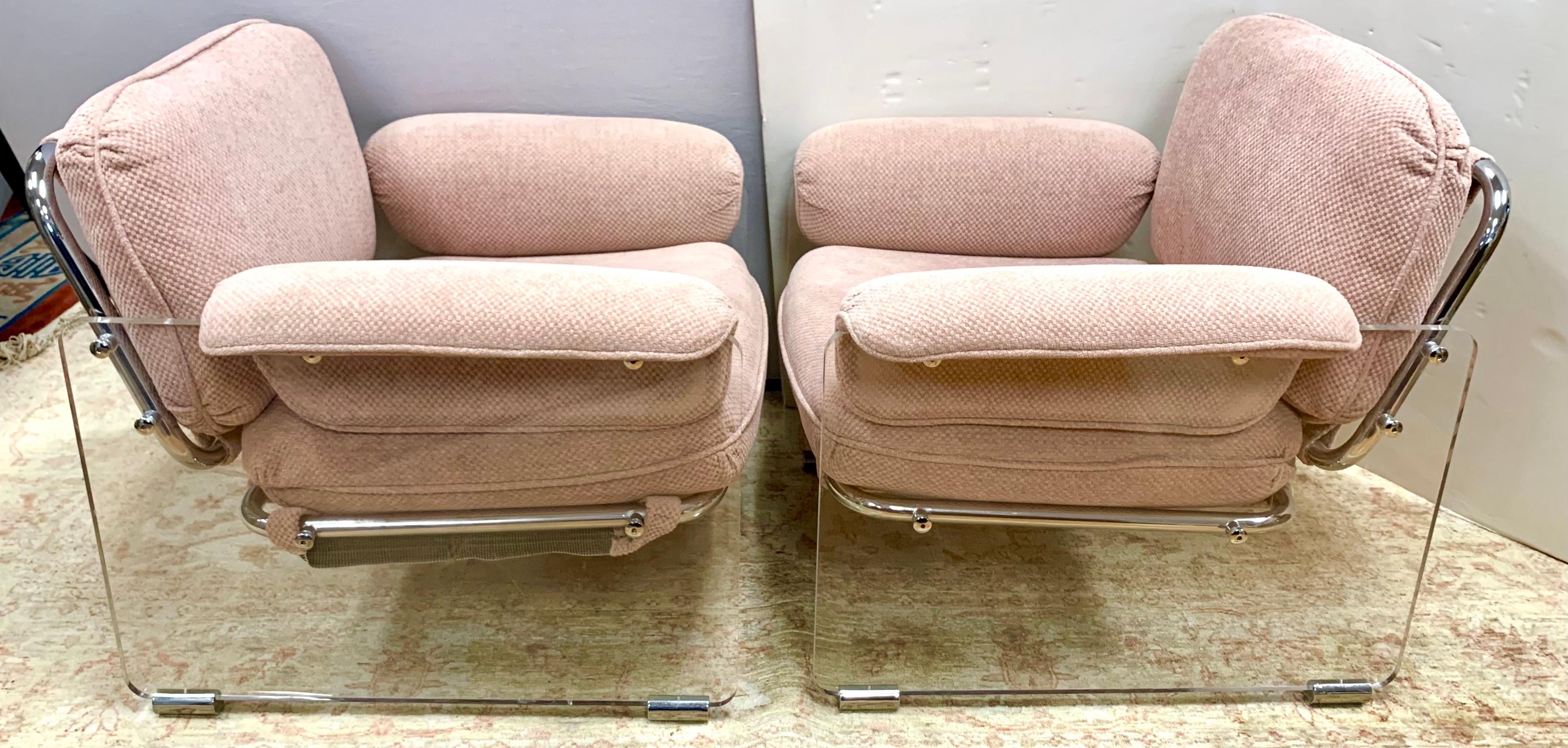 A pair of vintage 1970s Argenta lounge chairs by Pace Collection. Classic Pace design with Lucite and chrome frames upholstered in a pink chenille fabric.