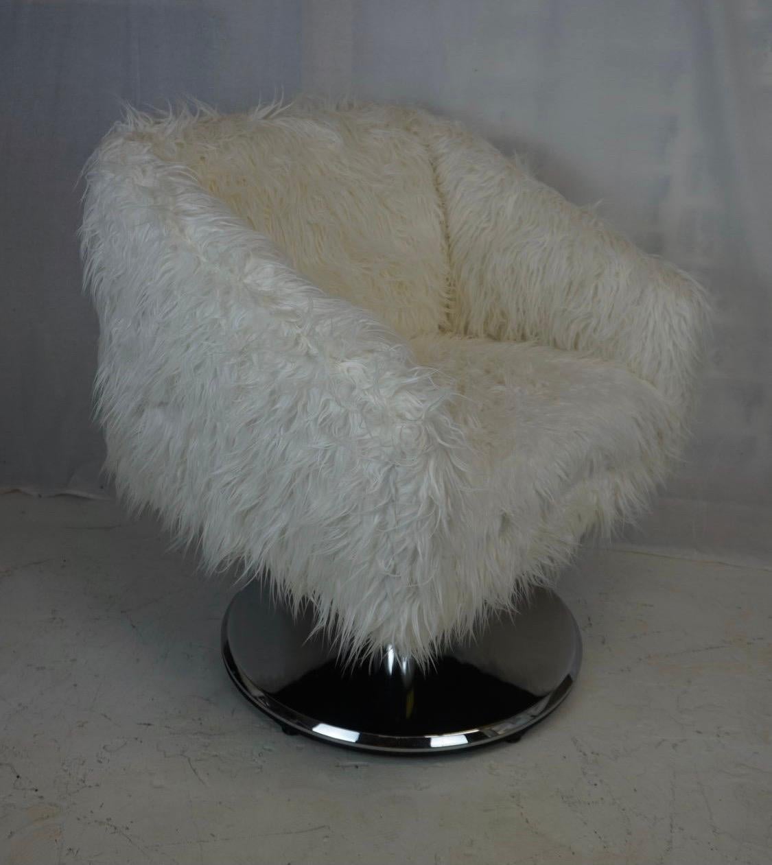 Upholstered in a coveted Mongolian faux fur, this pair of matching Pace swivel chairs are sure to impress. We like the 18