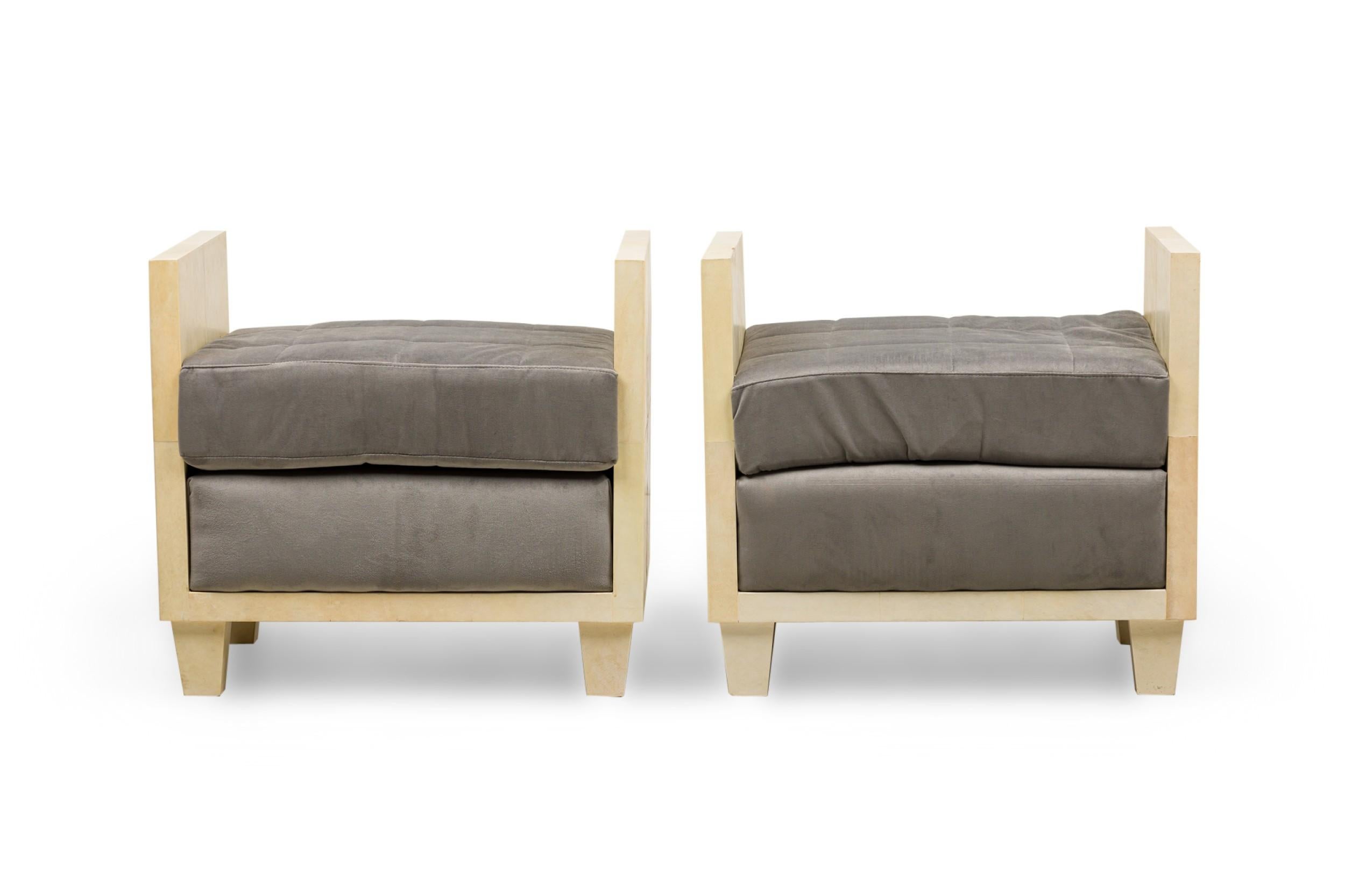 Pair of midcentury American parchment covered rectangular benches in a modern geometric style with upholstered, tufted seat cushions in a gray fabric, resting on 4 tapered legs. (In the manner of Samuel Marx).