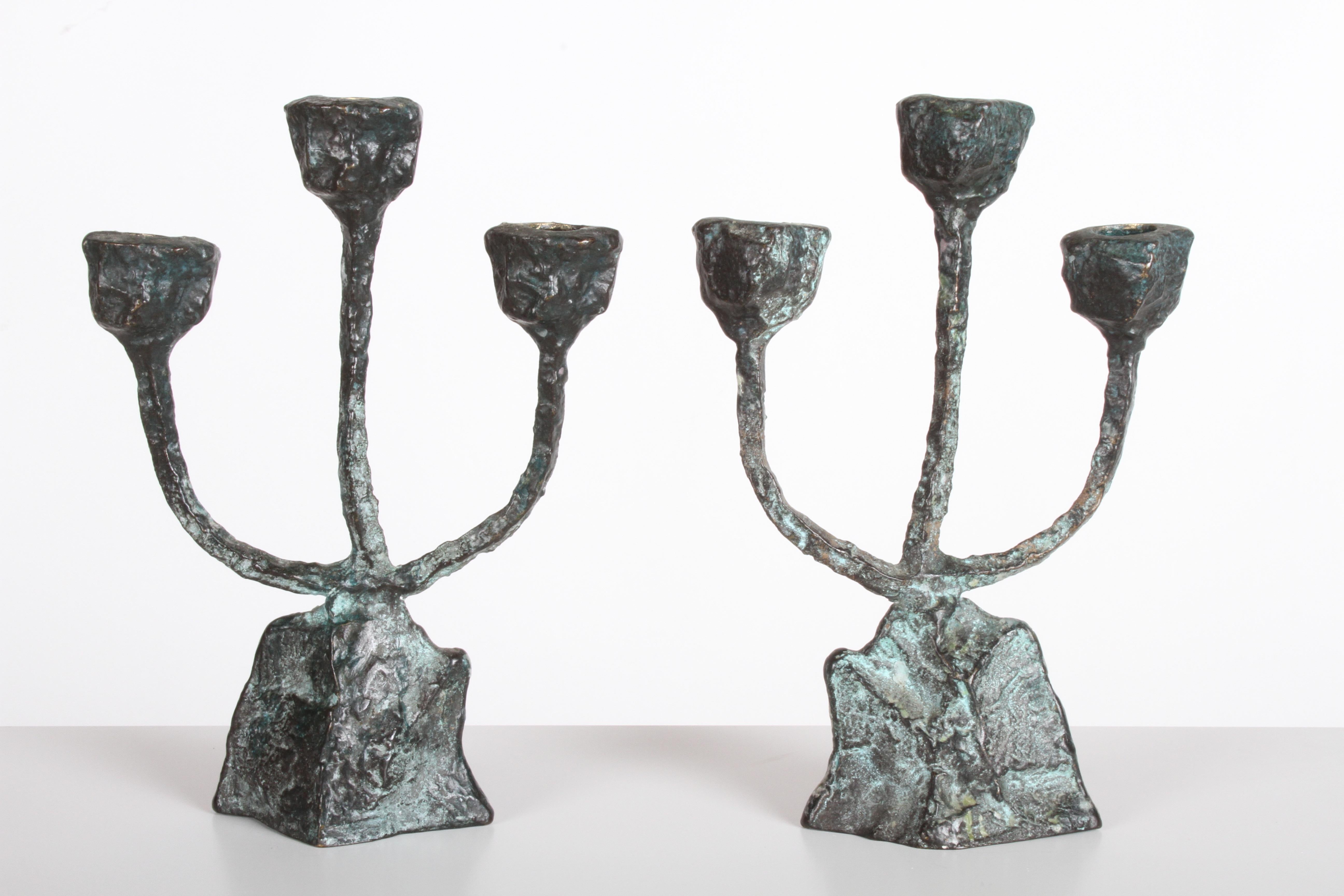 Pair of bronze patinated brutalist form candleholders or candlesticks in the style of Giacometti. Nice original condition. Some old wax residue on bases.