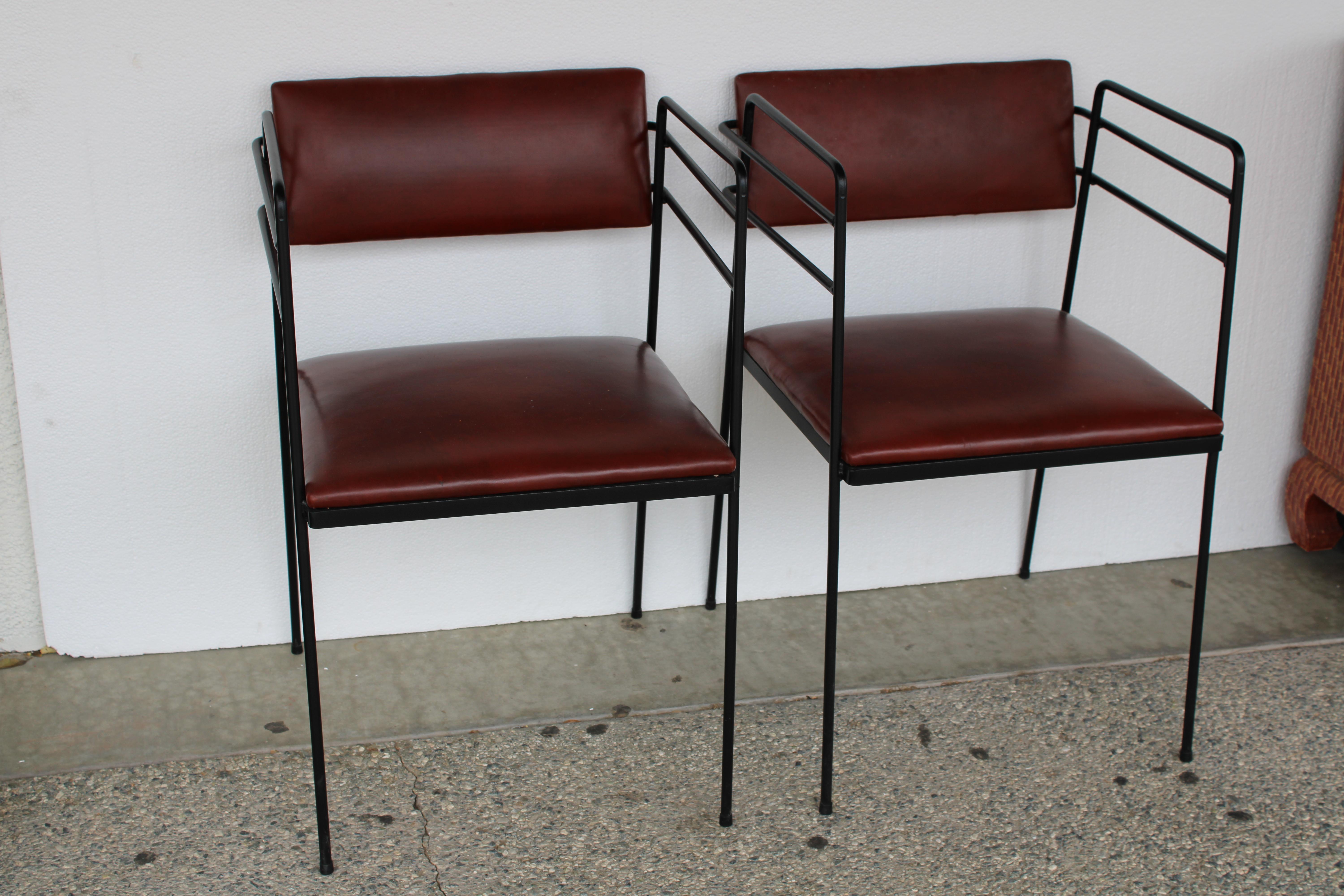 Pair of steel mid century patio chairs with original naugahyde cushions.  We had the frames professionally sand blasted and powder coated black (which was the original color).  Each chair measures 19.5