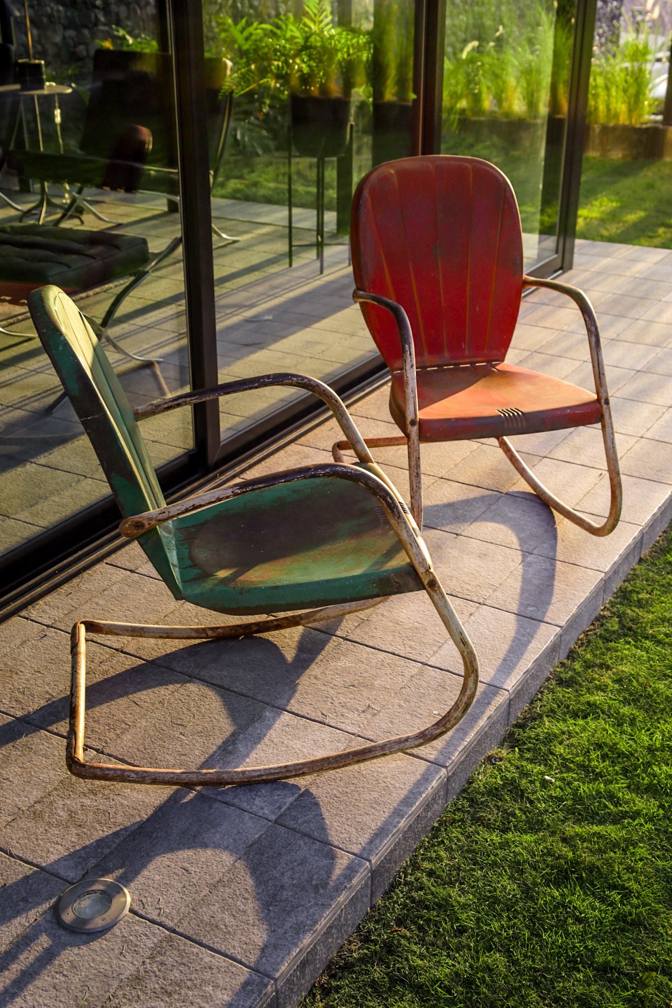 mid-century metal patio chairs. The classic outdoor chair has a 