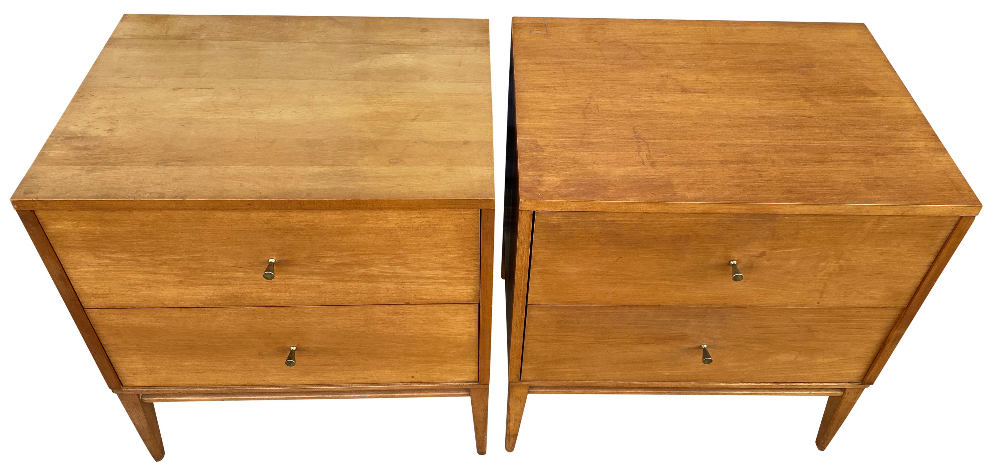 Beautiful pair of Paul McCobb 1950s #1503 blonde solid maple nightstands end tables double-drawer planner Group. Original brass cone pull knobs. Original tobacco blonde finish. Very modern designed pair of nightstands with wood standard base with 4
