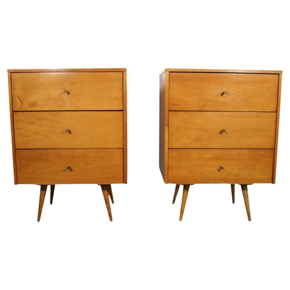 Nice pair of Paul McCobb Planner Group #1506 maple nightstands end tables triple-drawer. Original brass cone pull knobs. Finished in blonde maple. Very modern designed pair of nightstands with 4 tapered solid maple legs. All solid maple drawers