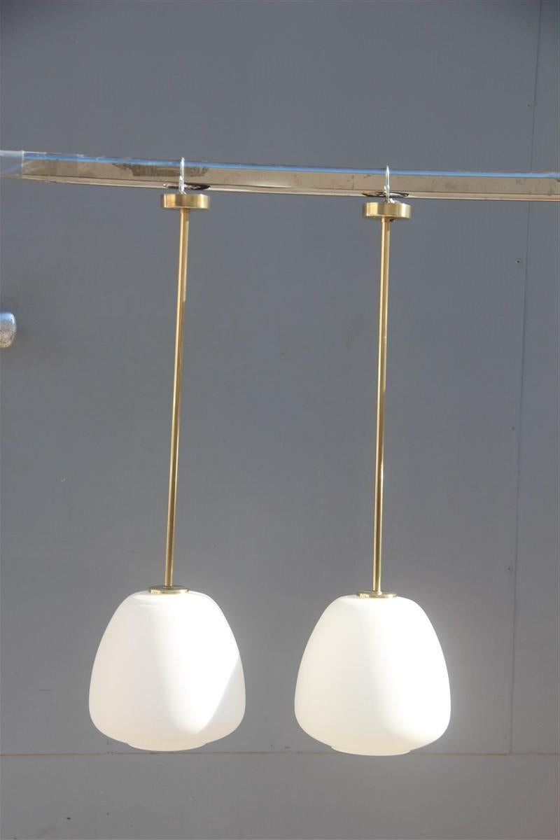 Pair of midcentury pendant lantern Italian design brass white Murano Stilnovo
Measures: Only glass height cm.2, diameter cm.18
1 light bulb E27 max 100 Watt each ceiling.