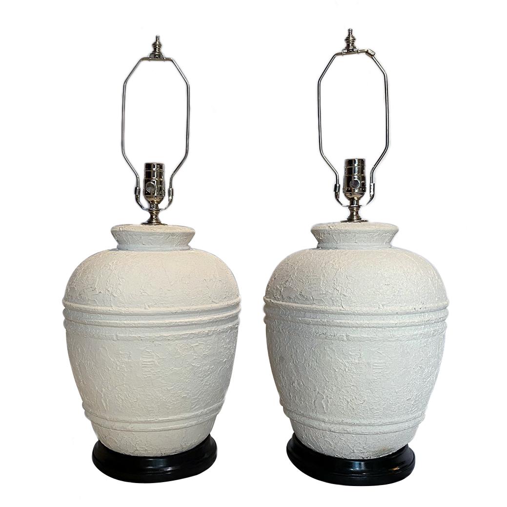 A pair of 1950s plaster table lamps with ebonized bases.

Measurements:
Height of body 15
