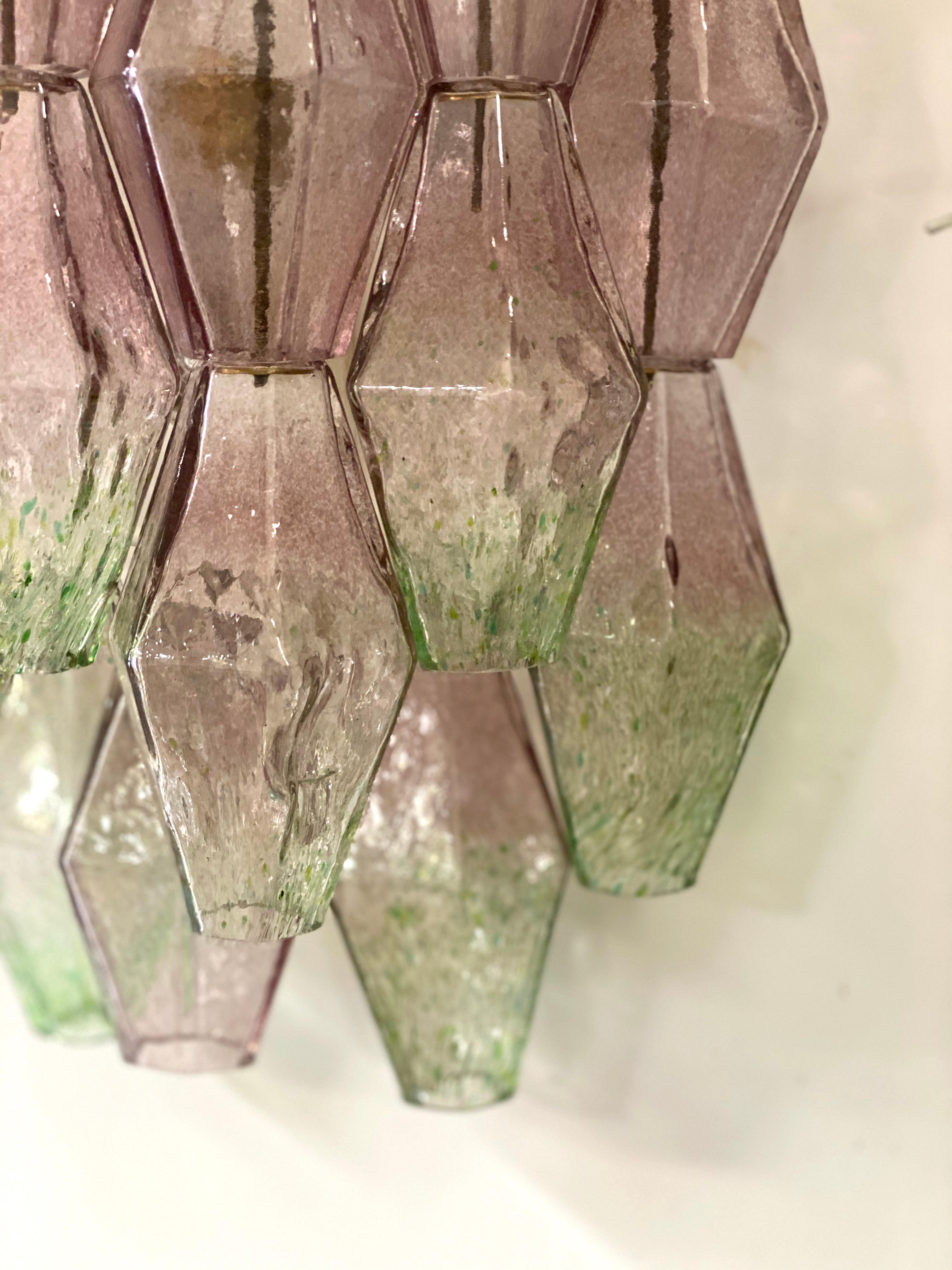 Pair of midcentury poliedri wall lights. Rare combination of pink and green colored Murano glass.
Provenance form a historic Roman Palace of the period.


    