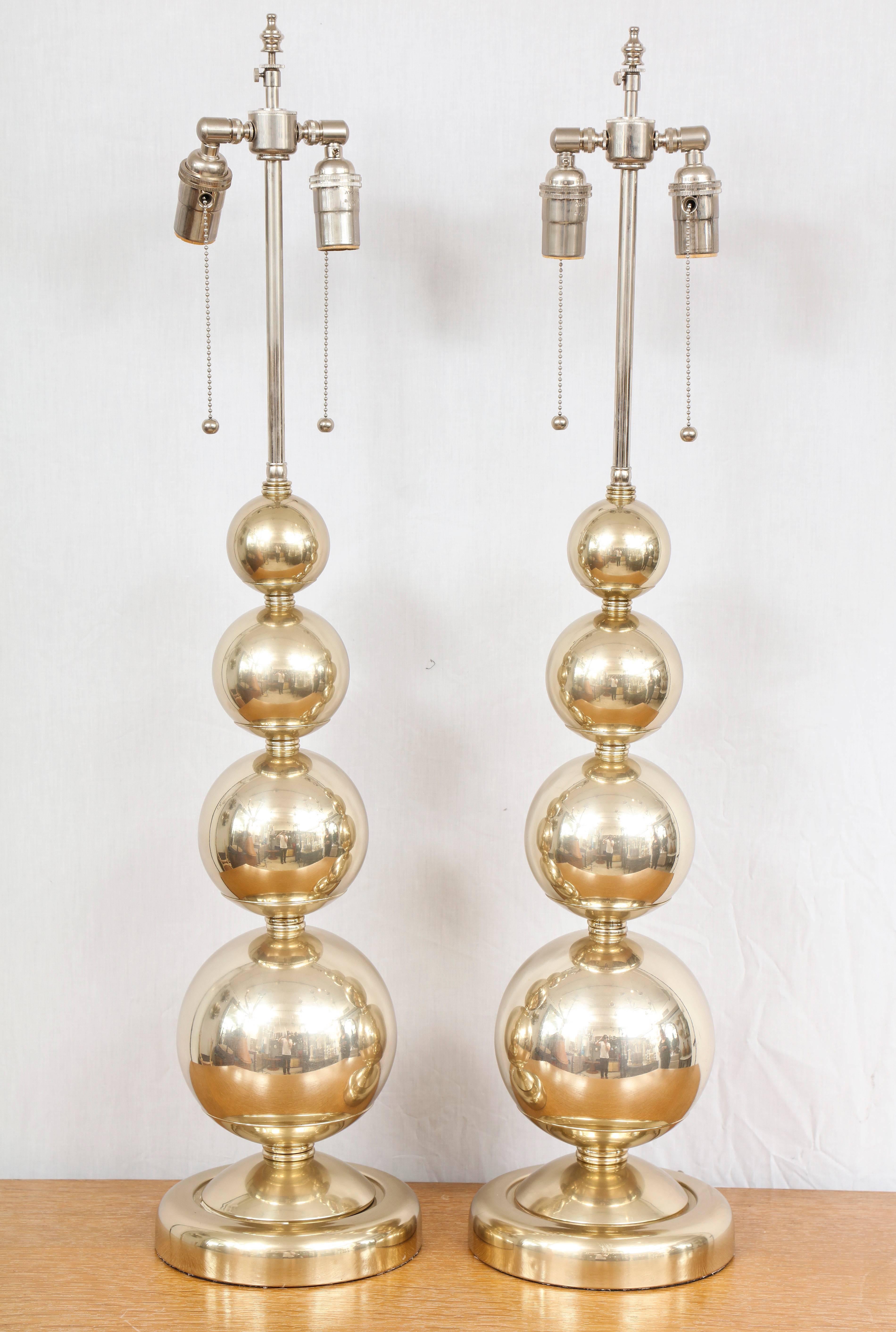 A pair of midcentury polished nickel spherical lamps.