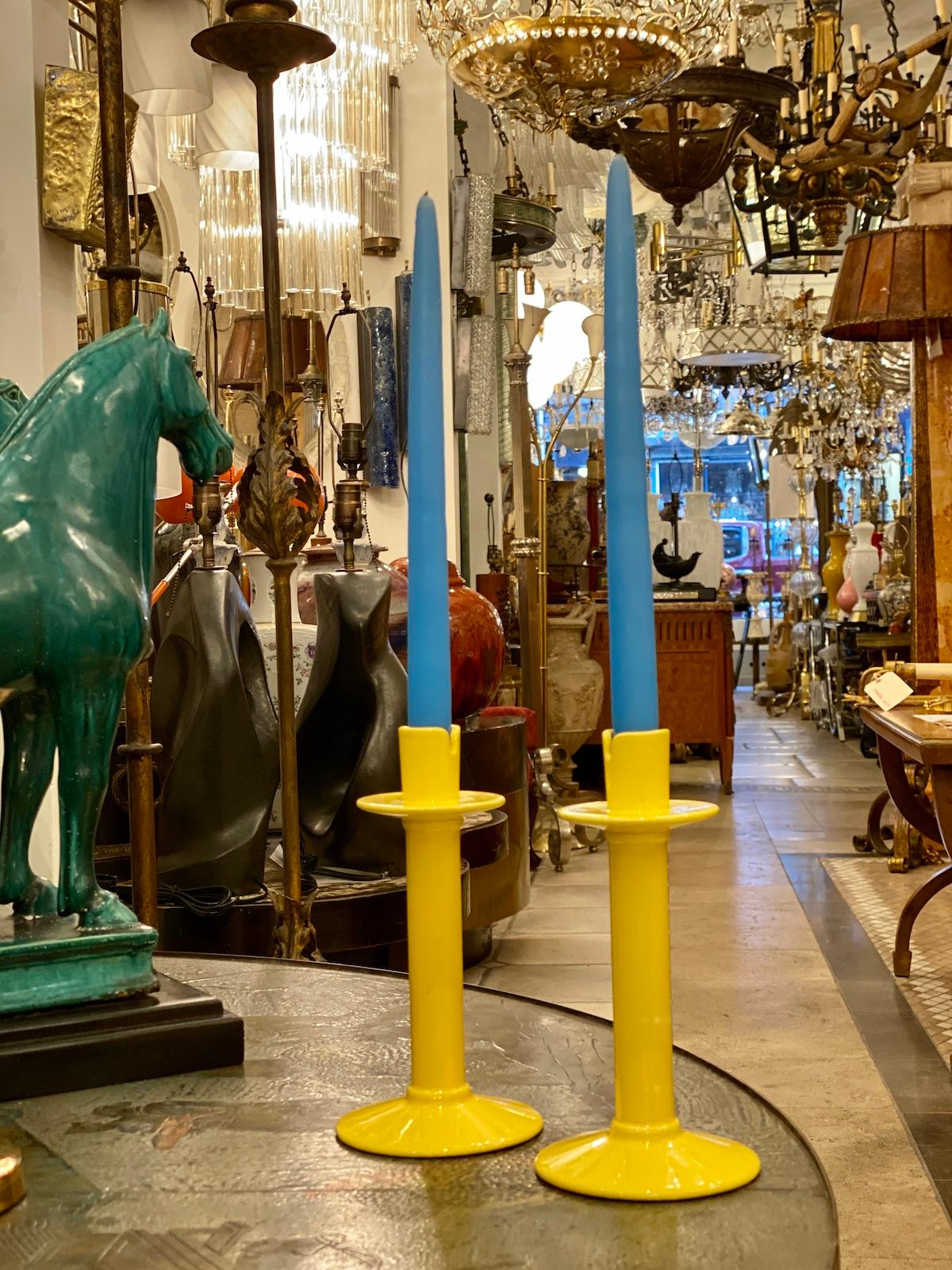 A pair of circa 1950s yellow-glazed Japanese porcelain candlesticks.

Measurements:
Height: 8.75?
Diameter of base: 4?