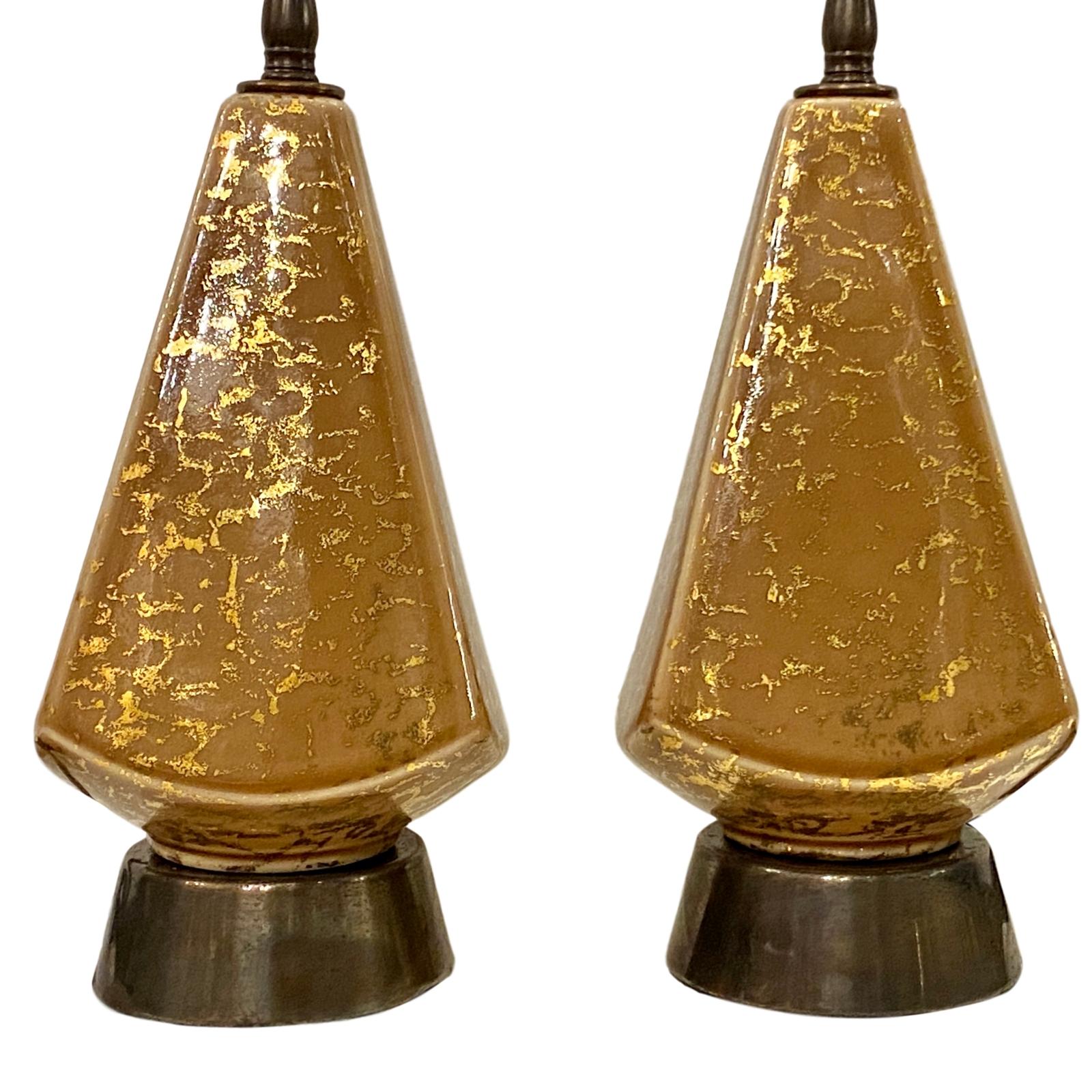A pair of circa 1950's Italian porcelain table lamps.

Measurements:
Height of body: 10