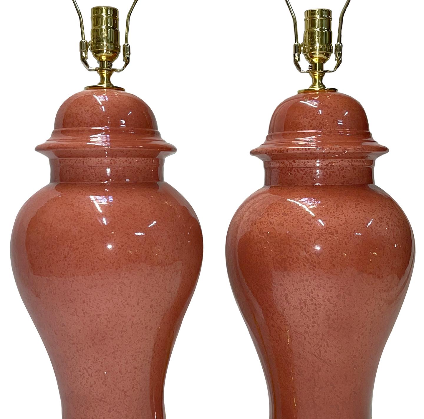 Pair of circa 1950's French porcelain table lamps with bronze bases.

Measurements:
Height of body: 21