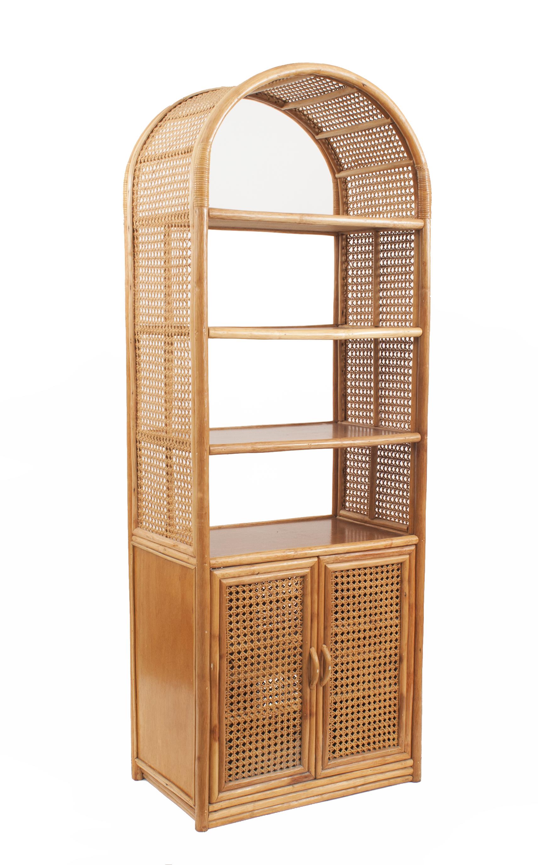 Pair of mid-century rattan rounded top bamboo etageres with natural woven wicker sides and three shelves above a pair of wicker covered doors (att: MCGUIRE).
  