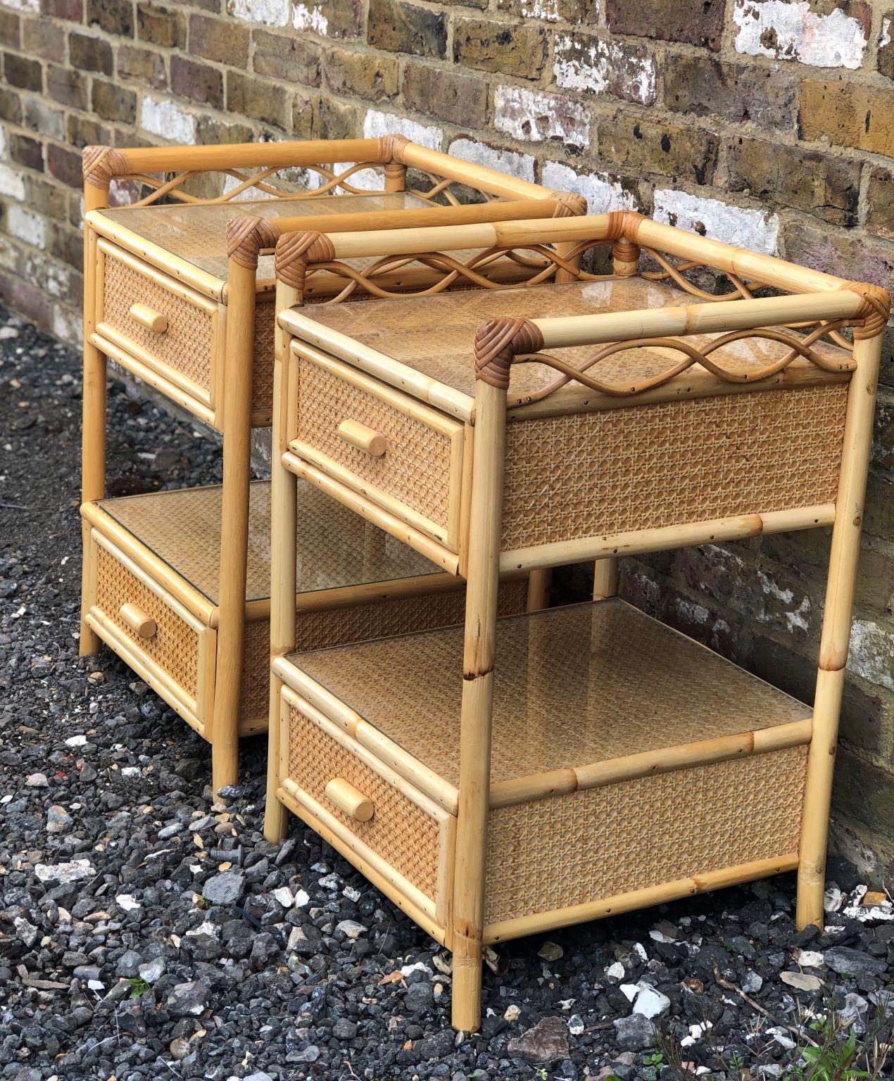 Pair of Mid Century rattan / cane nightstands / bedside tables by English company, Angraves, England, 1970s.

Each nightstand has 2 x drawers with cane handles, with a void in between the two, they are covered in cane weave matting, and each have 2