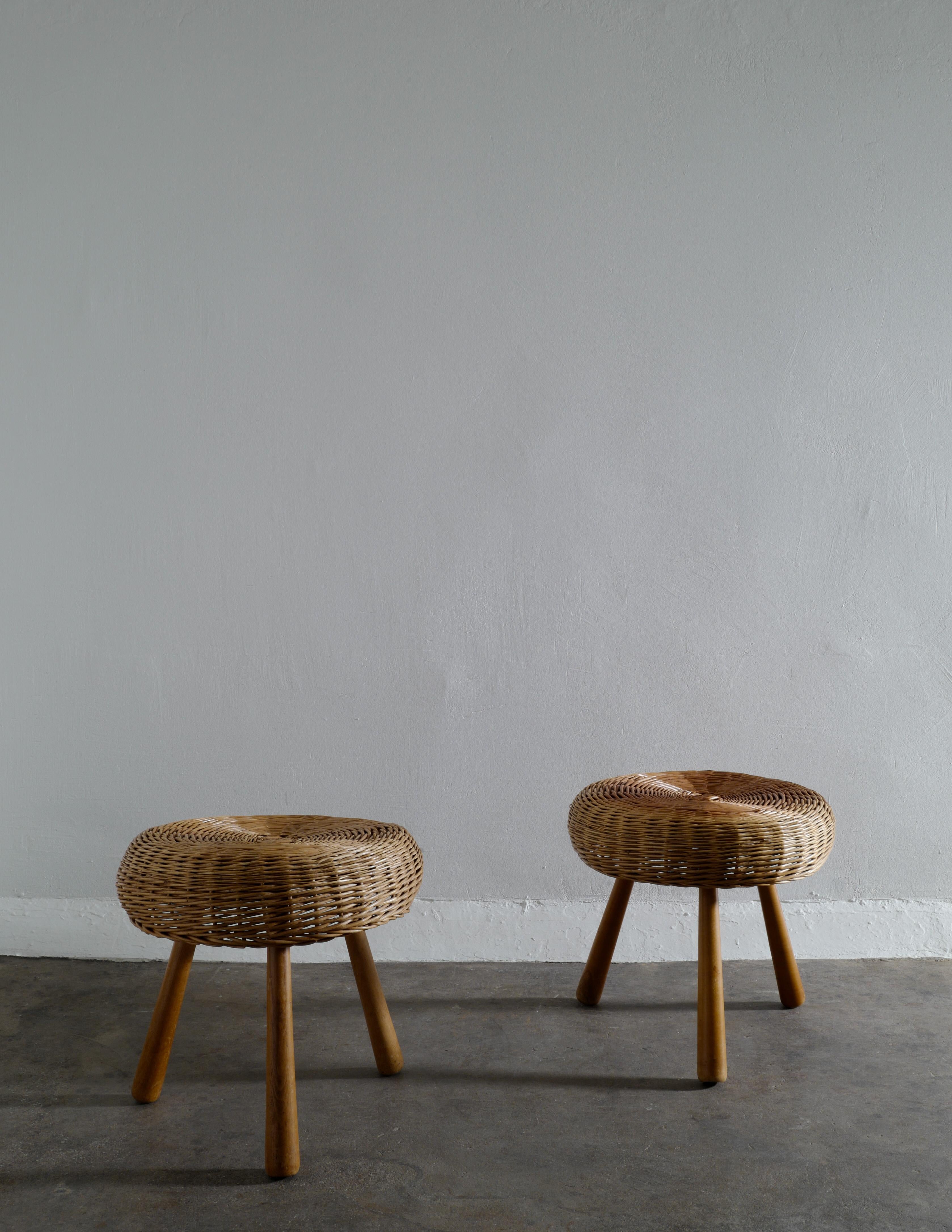 Rare pair of mid-century cane / rattan stools in beech in style of Tony Paul produced in Denmark 1960s. In good vintage and original condition with minimal signs of age and use. 

Dimensions: height: 42 cm, diameter: 46 cm.