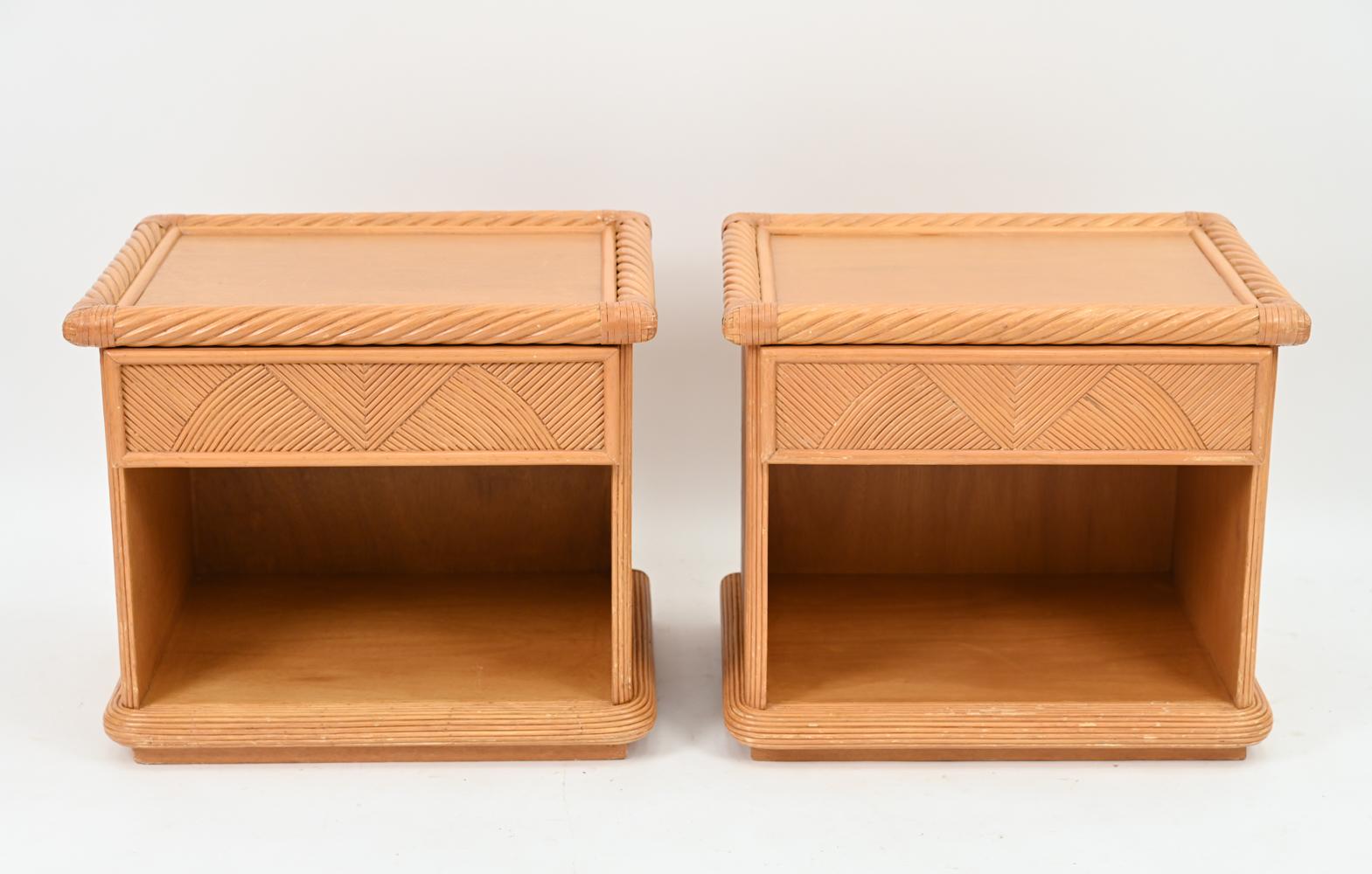 A pair of mid-century rattan single-drawer nightstands or end tables, attributed to Dux; no apparent labels. These Palm Beach-eqsue chests feature a geometric and twisted rattan design with great modern flair.
