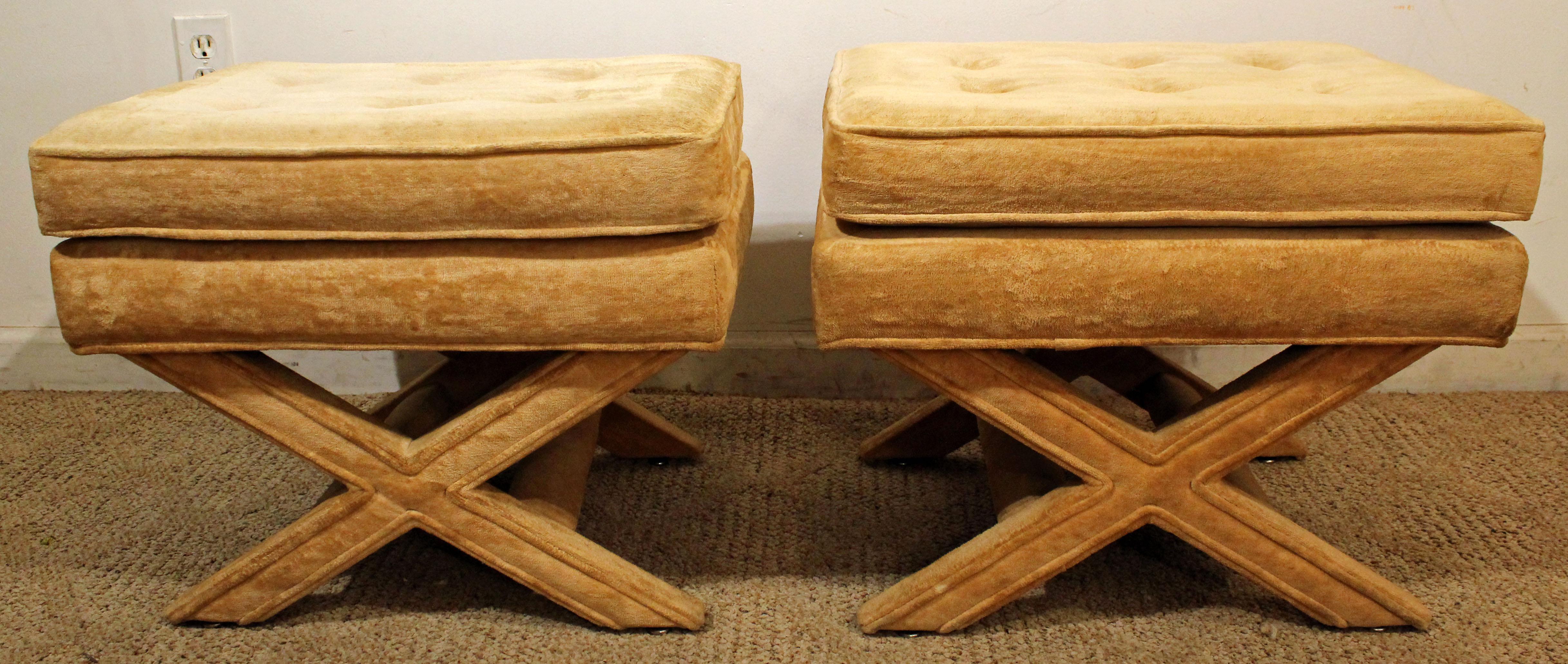 Offered is a great pair of matching ottomans by American of Martinsville. They look to made of velvet-type upholstery with an X-base. The set is in good condition showing minor age wear. These are signed by American of Martinsville. A great set to
