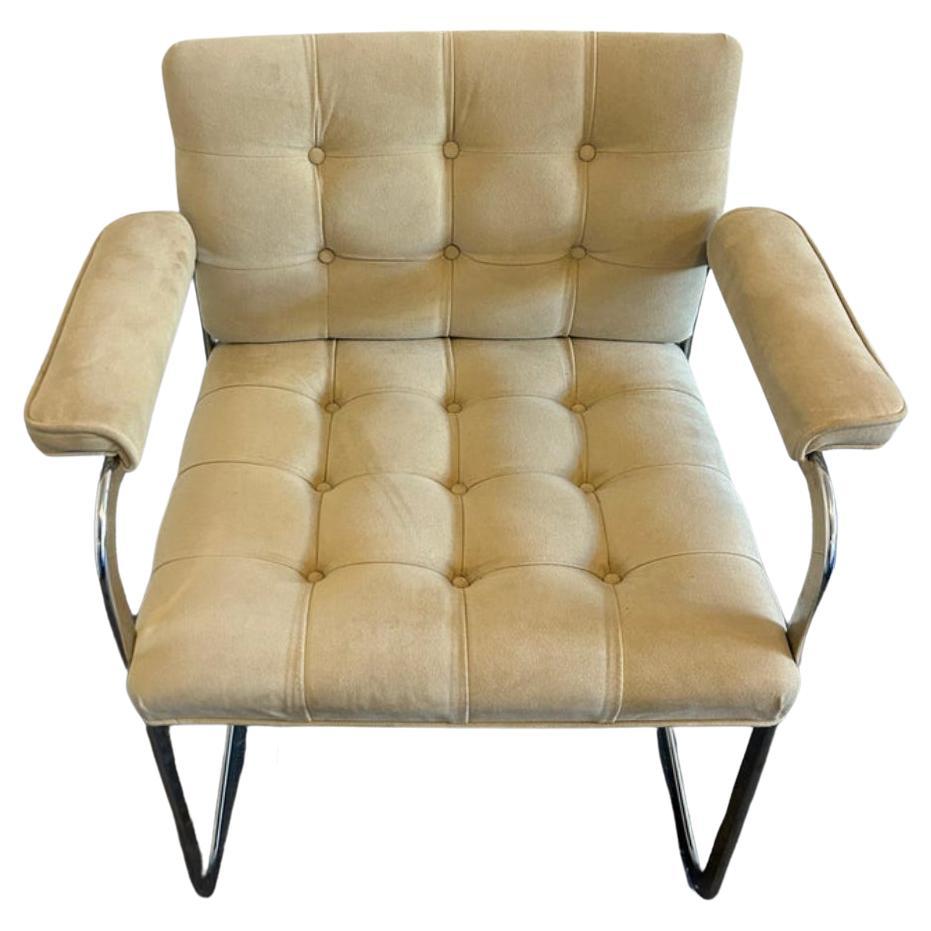 A unique pair of RH-304 Leather Arm chairs. designed by Robert Haussmann and manufactured by Stendig De Sede. This pair was made circa 1960. these chairs are upholstered in tan suede. The rounded flat bar tube frames are made of chrome-plated steel.