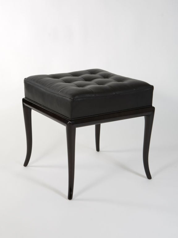 Elegant pair of ebonized Classic Robsjohn-Gibbings stools upholstered in black button tufted leather. Beautiful shape to legs and great design. Very handsome pair!