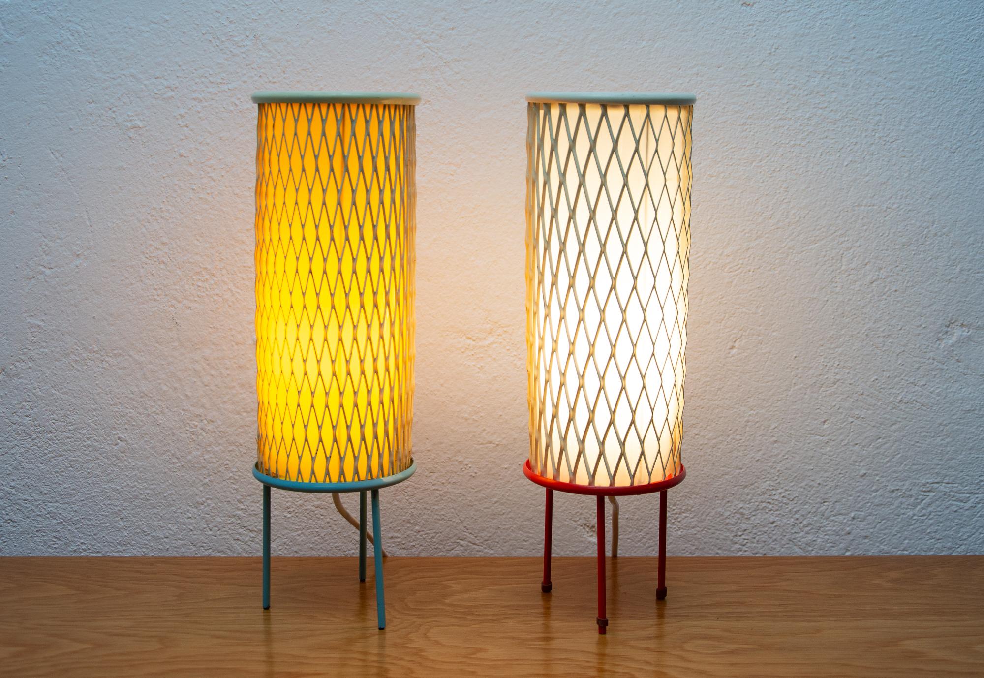 These rocket table lamps were made in the former Czechoslovakia in the 1960s. The design of these lamps is connected with the so-called Brussels period, associated with the world-famous EXPO 58 exhibition in Brussels, where the Czechoslovak Pavilion