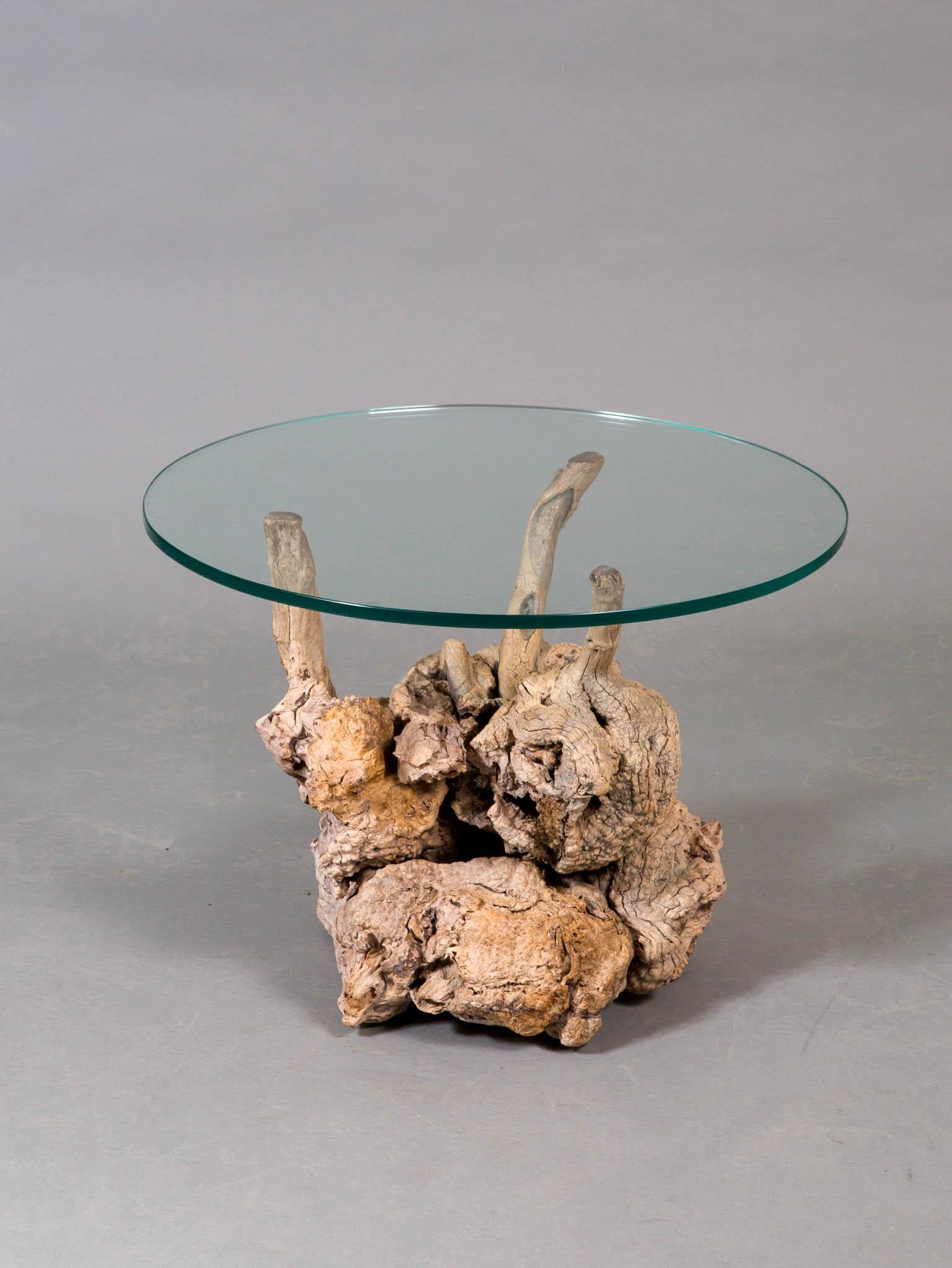 Sculptural pair of midcentury organic root side tables with round glass tops.