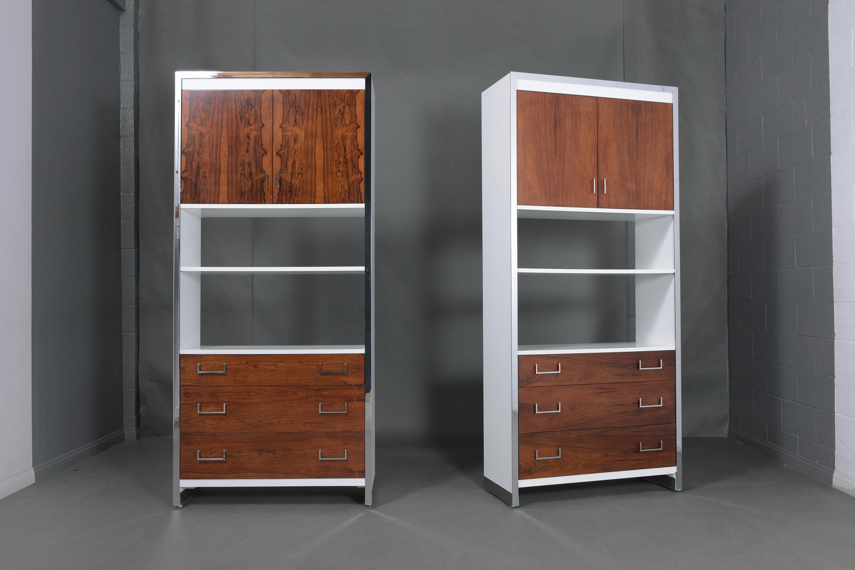 An extraordinary pair of mid-century bookcases hand-crafted out of rosewood this set has been professionally restored by our team of craftsmen. This 1960s bookshelf features a beautiful rosewood and white color combination with a lacquered finish