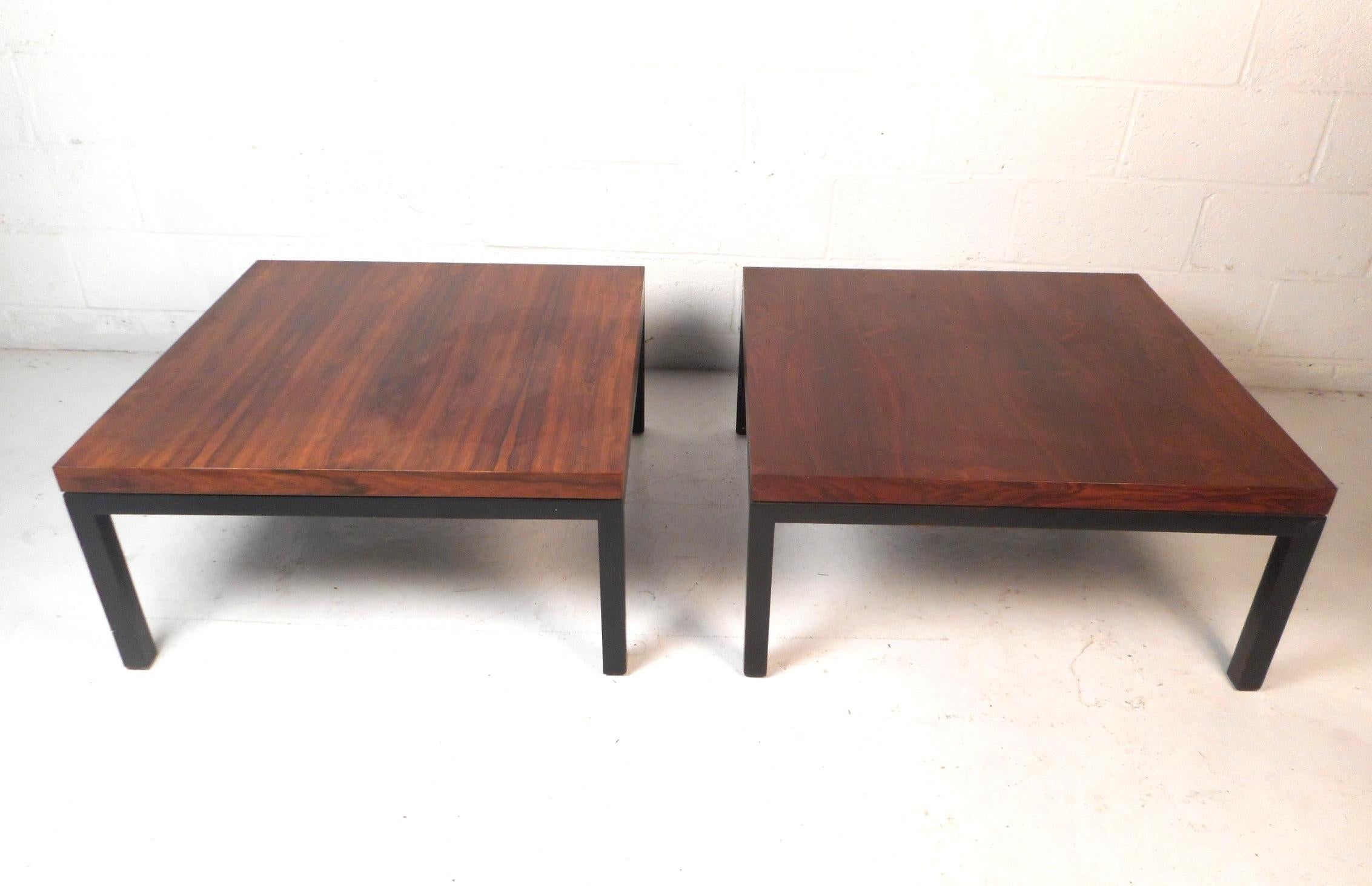 These stunning midcentury designer coffee tables feature beautiful finished rosewood tabletops, and sturdy ebonized legs. These sought after tables are a perfect addition to any modern interior. Made by Milo Baughman for Thayer Coggin in 1967.