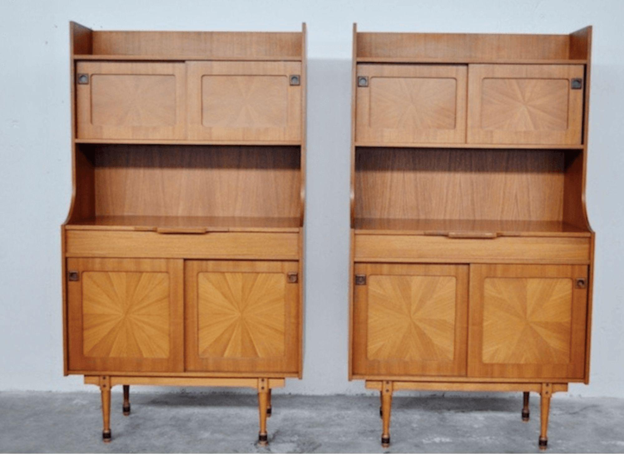 Elevate your living space with this stunning pair of Mid-Century rosewood credenzas with riser, a true testament to Italian craftsmanship and timeless design. Crafted from the finest rosewood, these credenzas exude elegance and sophistication,