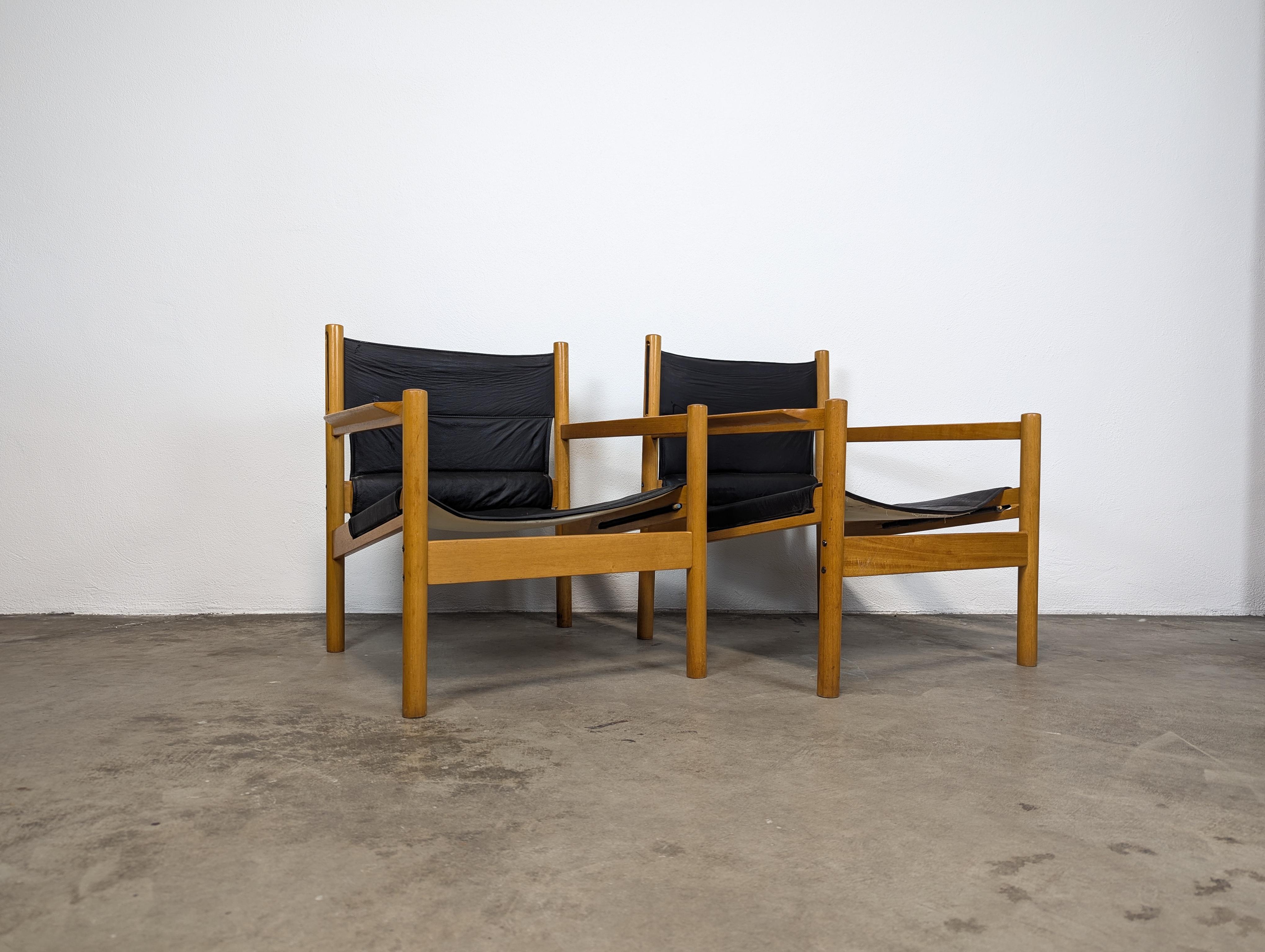 For sale is a stunning pair of Vintage Mid Century Safari Style 'Roxinho' Lounge Chairs by renowned designer Michel Arnoult, originating from Brazil and crafted in the 1960s. These exquisite chairs showcase a timeless design with a hardwood frame,
