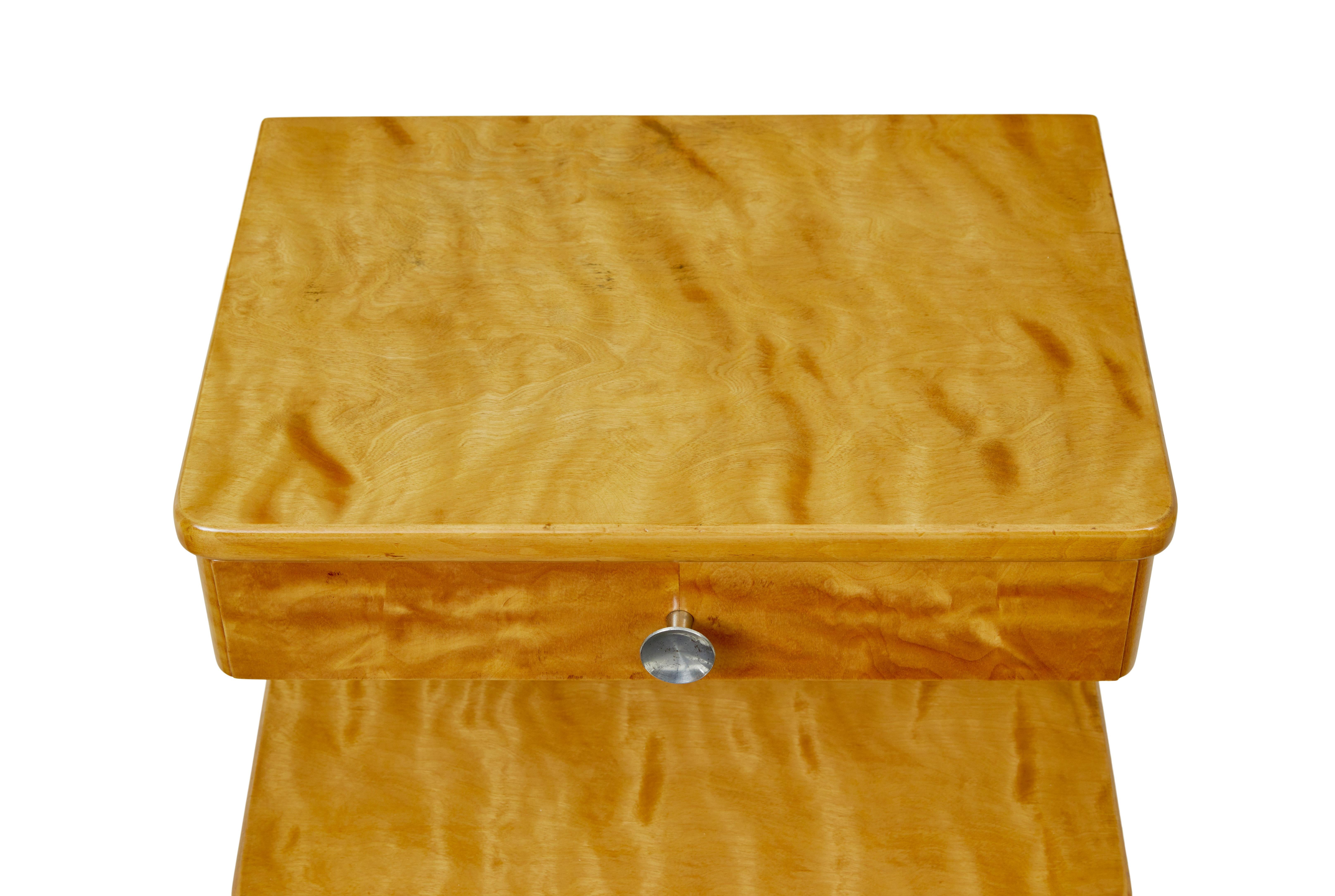 Pair of Swedish birch night stands circa 1950.

Elegant 2 tier bedside cupboards very much in the grace/art deco taste. Rectangular top surface with a single drawer directly underneath. Open storage space aperture with a single door cupboard which