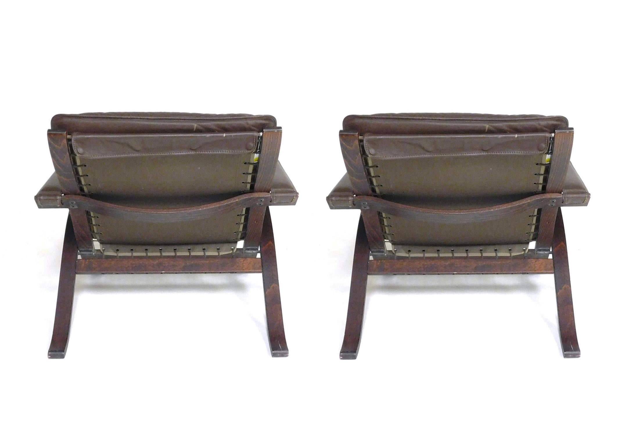 Pair of Mid century Scandinavian modern brown leather Safari flex lounge chairs  In Good Condition For Sale In BROOKLYN, NY