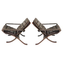 Retro Pair of Mid century Scandinavian modern brown leather Safari flex lounge chairs 