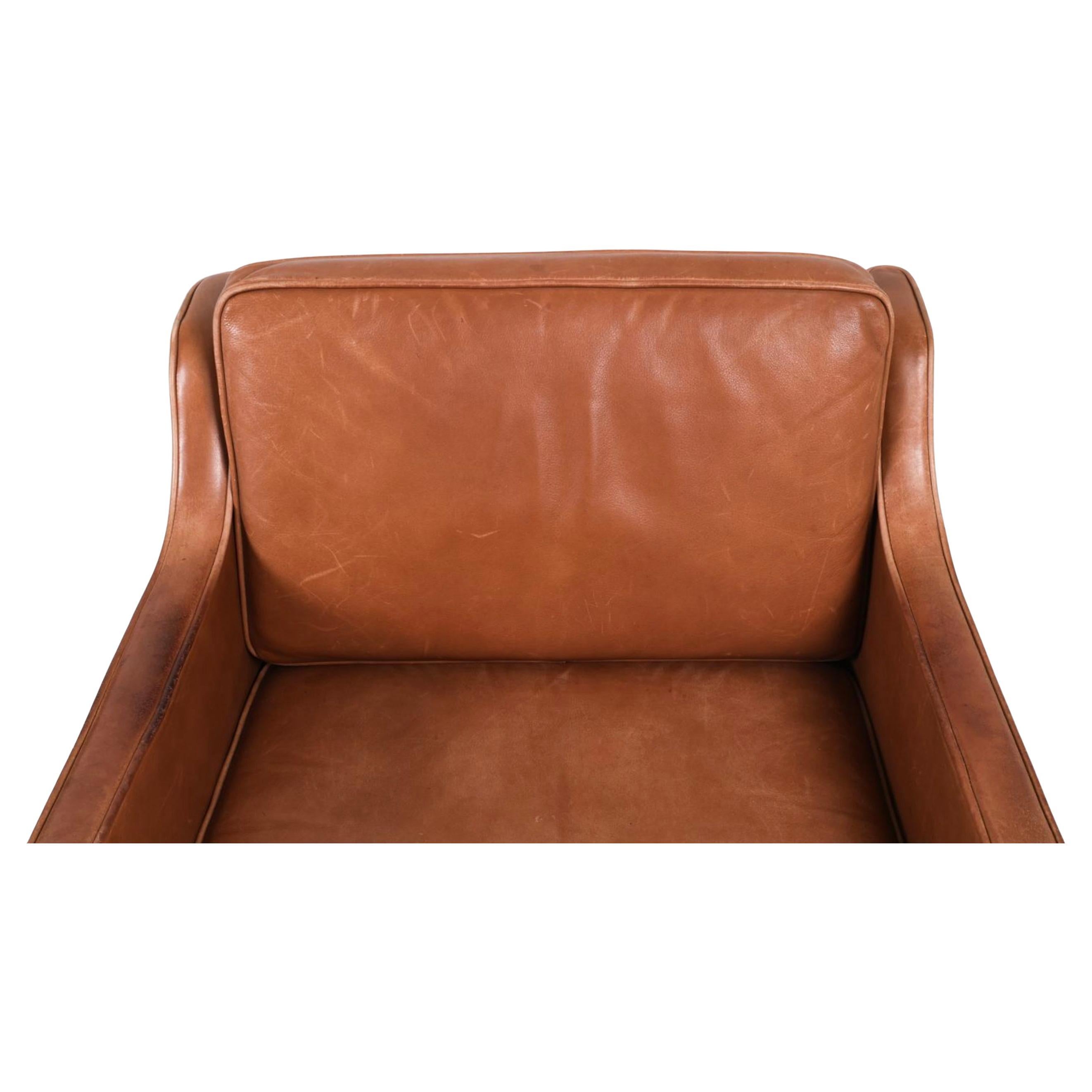 Beautiful Pair of Mid Century Scandinavian modern Brown Leather lounge chairs with oak frames. Leather show nice patina with signs of use and age. Very comfortable chairs great for your beach house or House in the mountains. Very high quality Danish