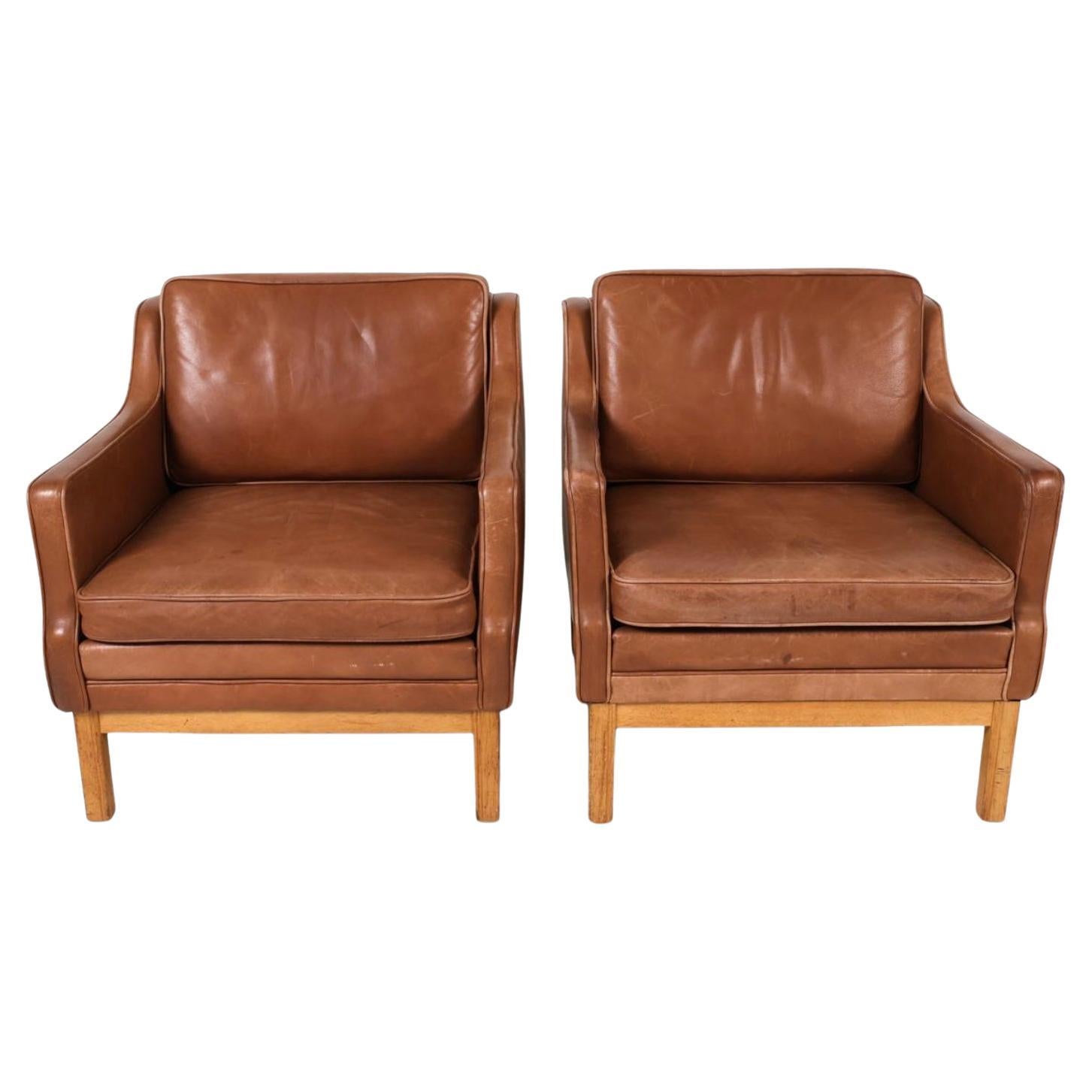 Woodwork Pair of Mid Century Scandinavian modern Brown Oak Leather Lounge chairs For Sale