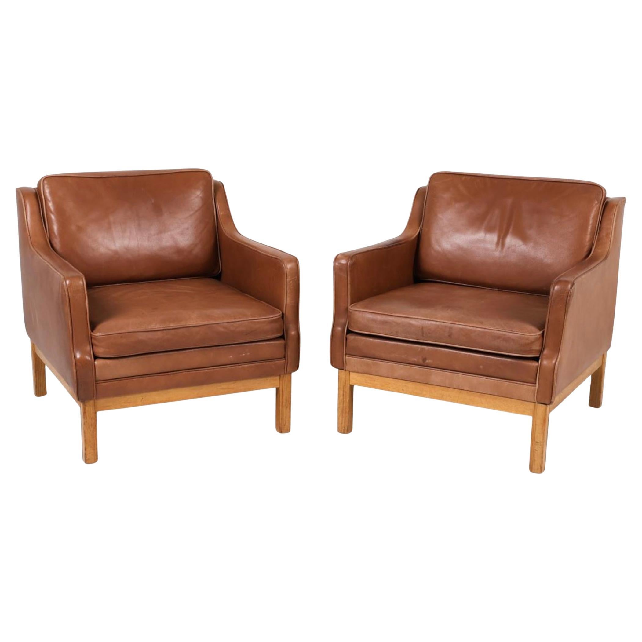 Pair of Mid Century Scandinavian modern Brown Oak Leather Lounge chairs For Sale