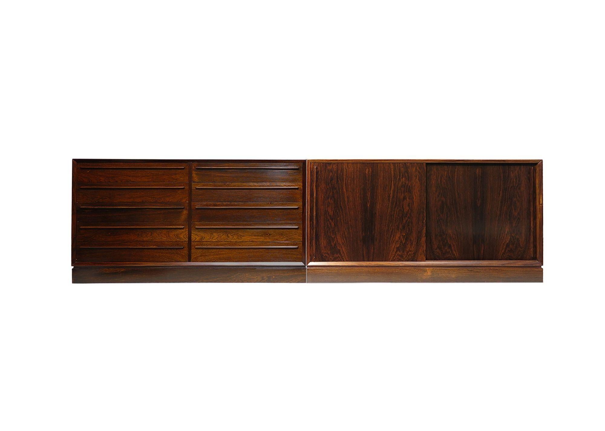 A pair of finely crafted Brazilian rosewood cabinets showcasing masterfully beveled and mitered edges with dynamic, book-matched grains. The low dresser cabinet features eight drawers with sculpted rosewood pulls, while the low credenza has two