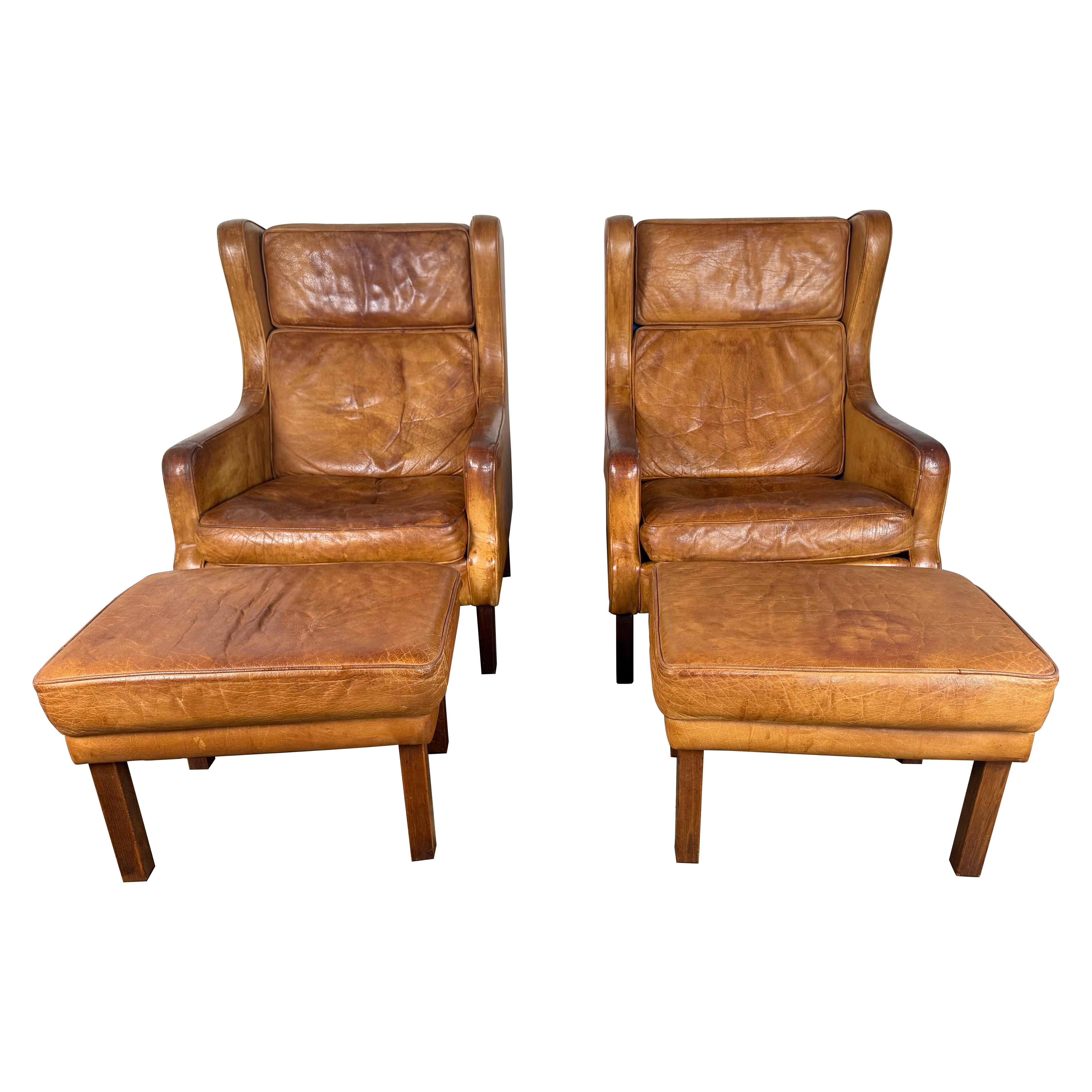 Paire de chaises longues scandinaves en cuir Wingback du milieu du siècle dernier en vente