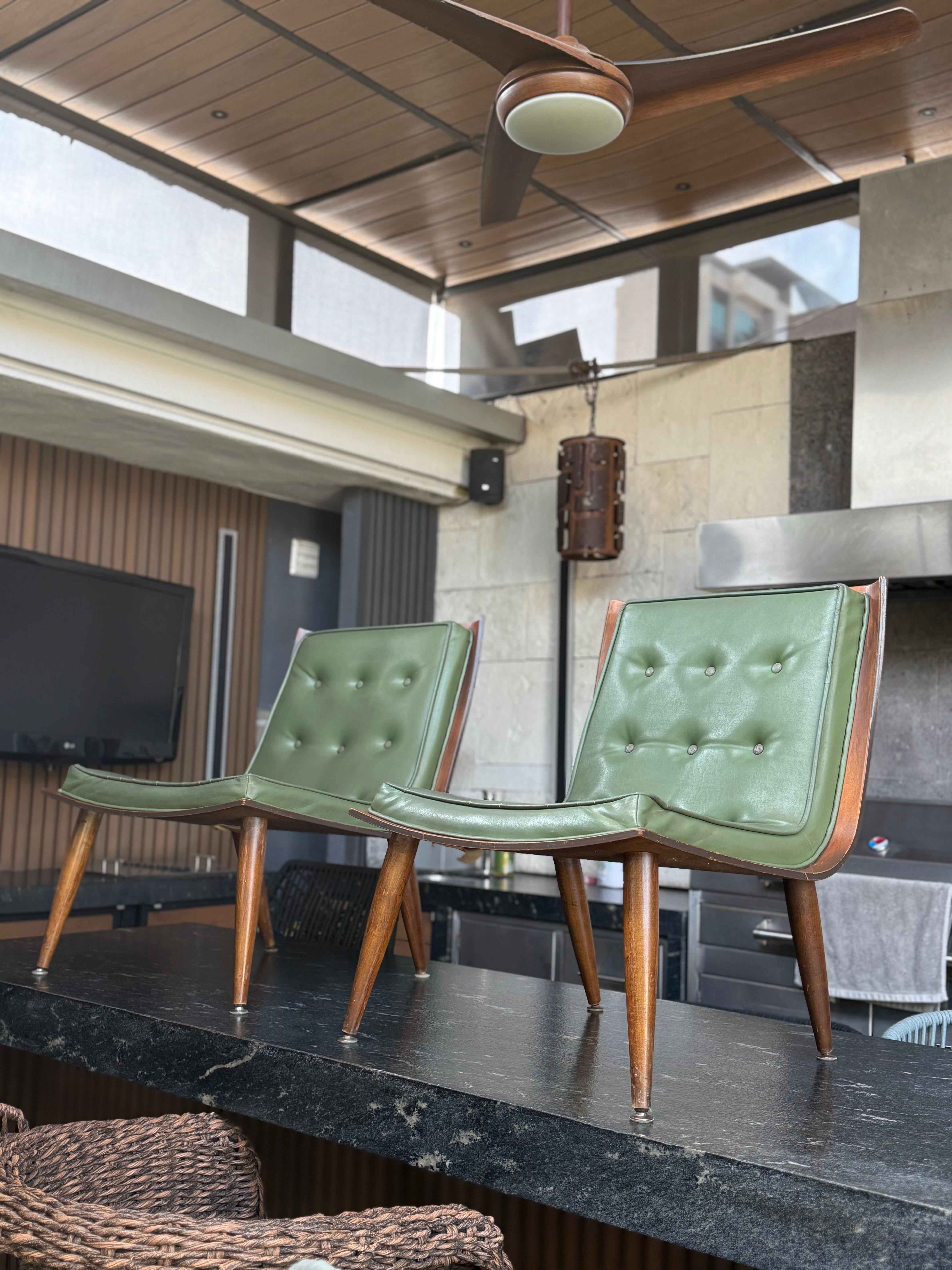 Pair of Vintage 1960s scoop chairs by Carter Brothers. Fantastic organic inspired leaf-like scoop profile to the chair. We're offering unrestored, original tapestry with age-related details and some scratches on the wood. In our opinion, they look