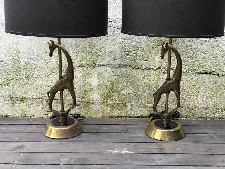 Awesome pair of sculptural brass giraffe table lamps by Rembrandt Lamp Company, 1950s.
Beautiful aged patina, rewired, shades on included.