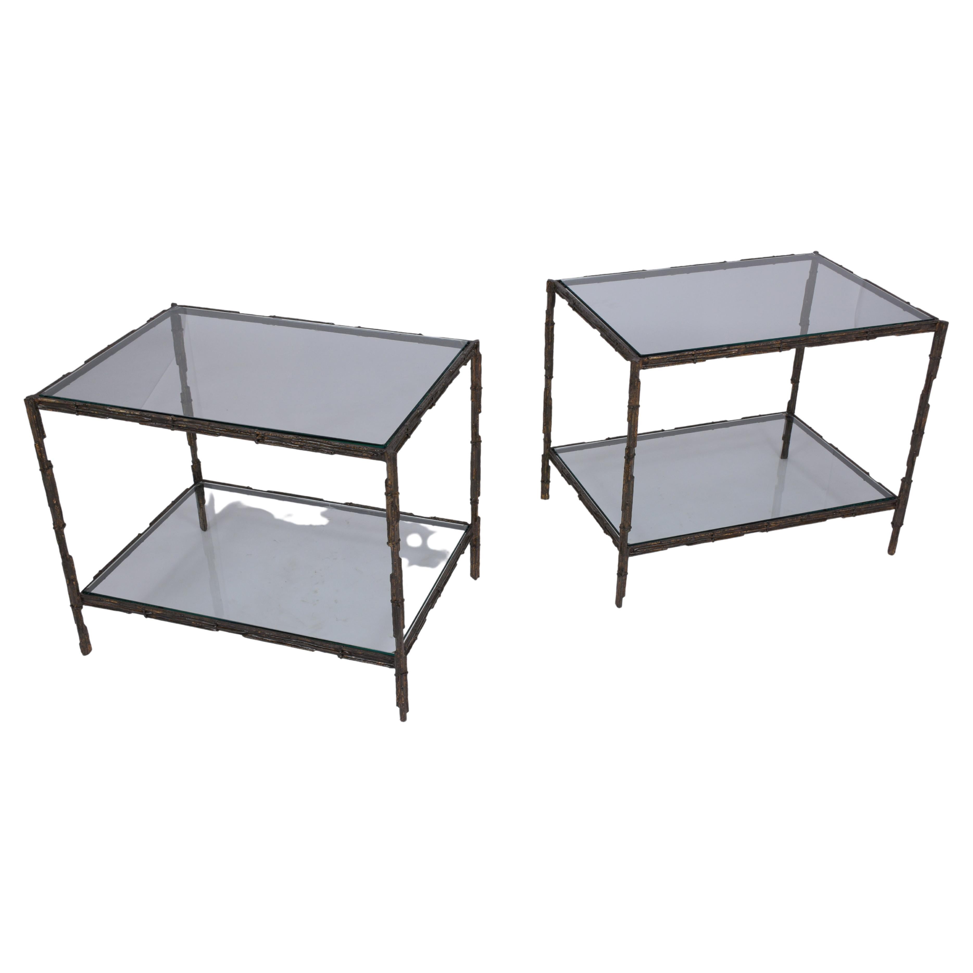 An extraordinary pair of brutalist side tables in great condition beautiful crafted out of iron in great condition and fully restored by our craftsmen. These mid-century end tables feature two-tier tops made from a new clear glass with flat polished