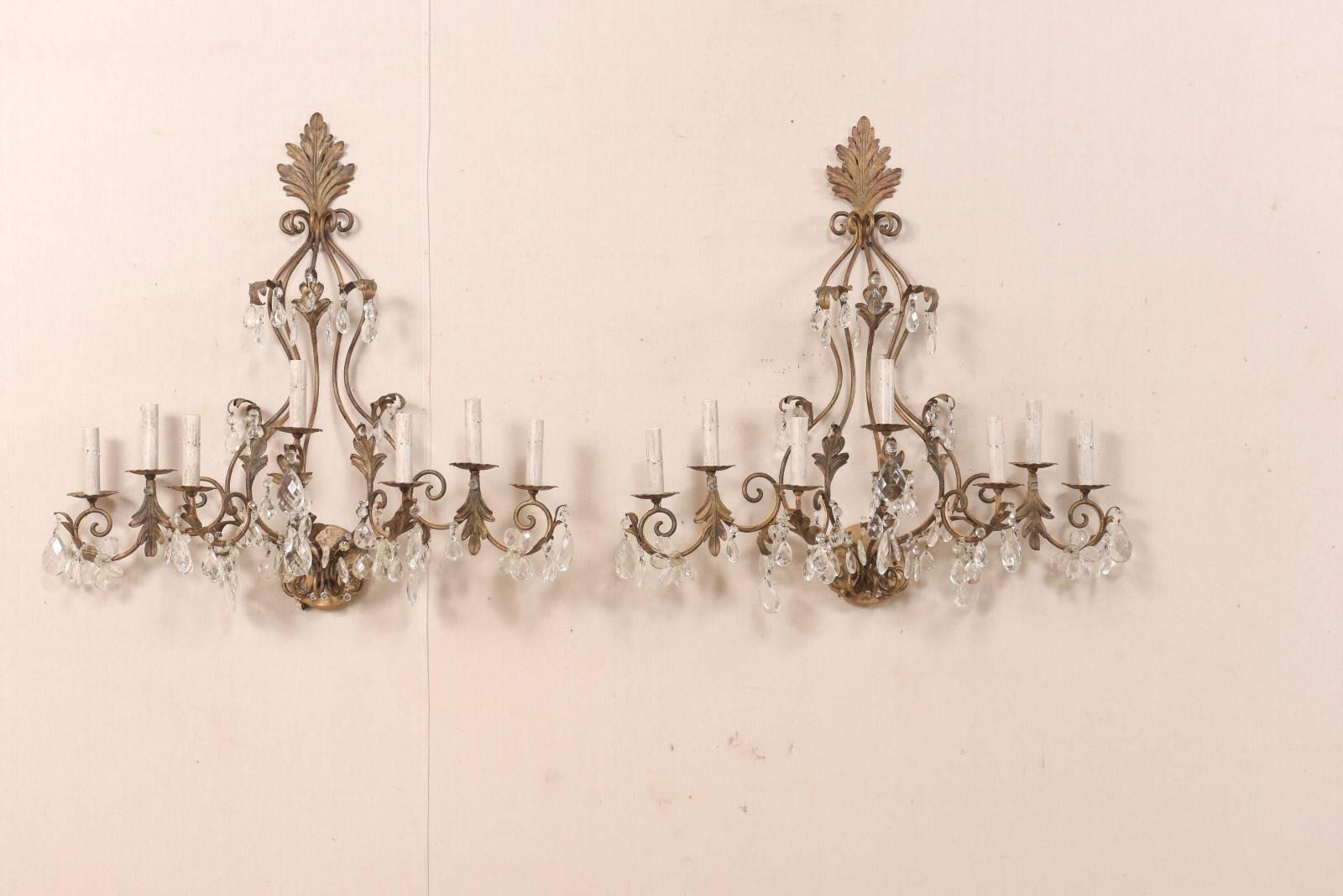 French Pair of Mid-Century Seven-Light Crystal and Iron Sconces with Leaf Crest Tops For Sale