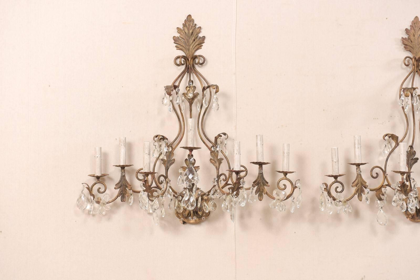 Patinated Pair of Mid-Century Seven-Light Crystal and Iron Sconces with Leaf Crest Tops For Sale