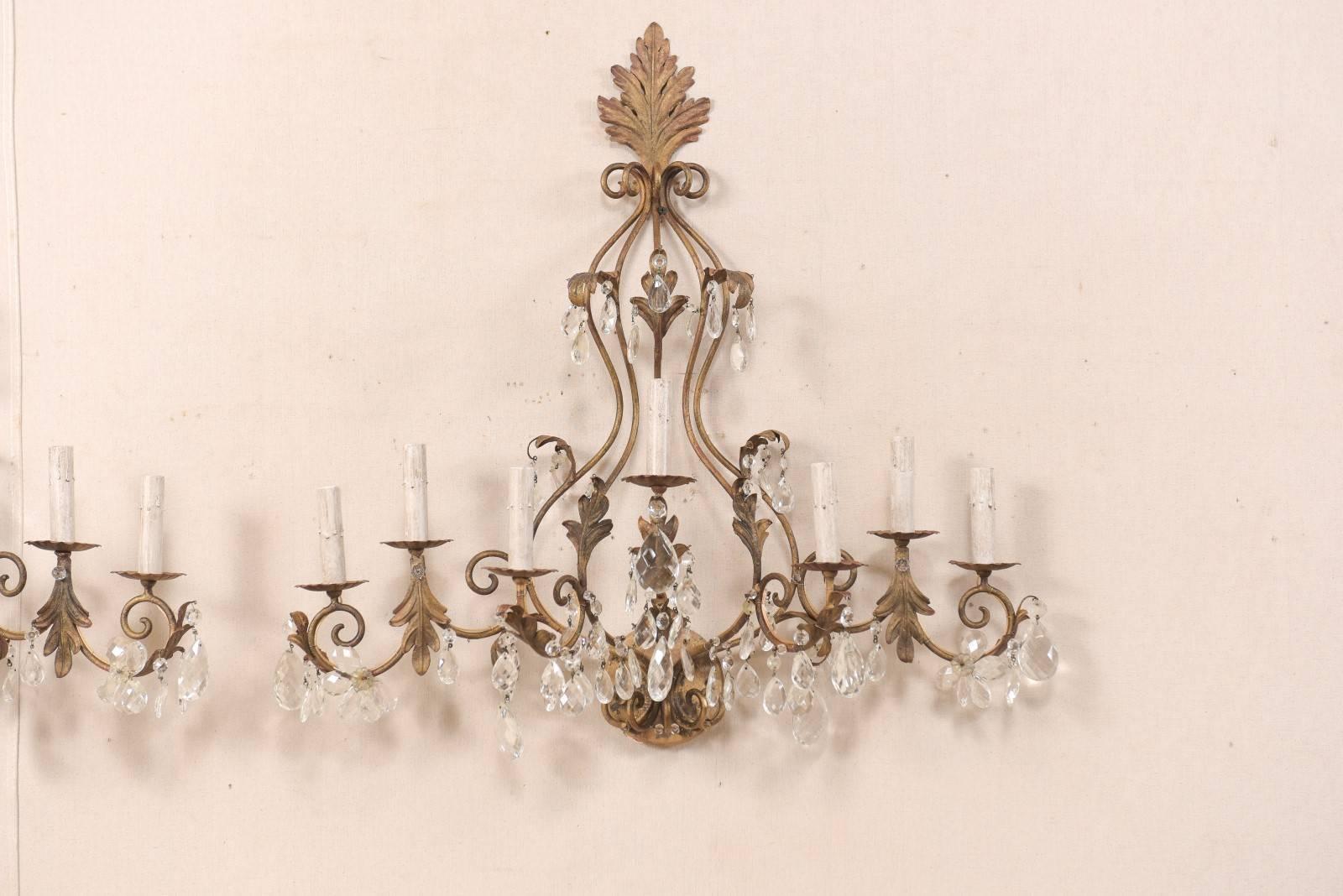 Pair of Mid-Century Seven-Light Crystal and Iron Sconces with Leaf Crest Tops In Good Condition For Sale In Atlanta, GA